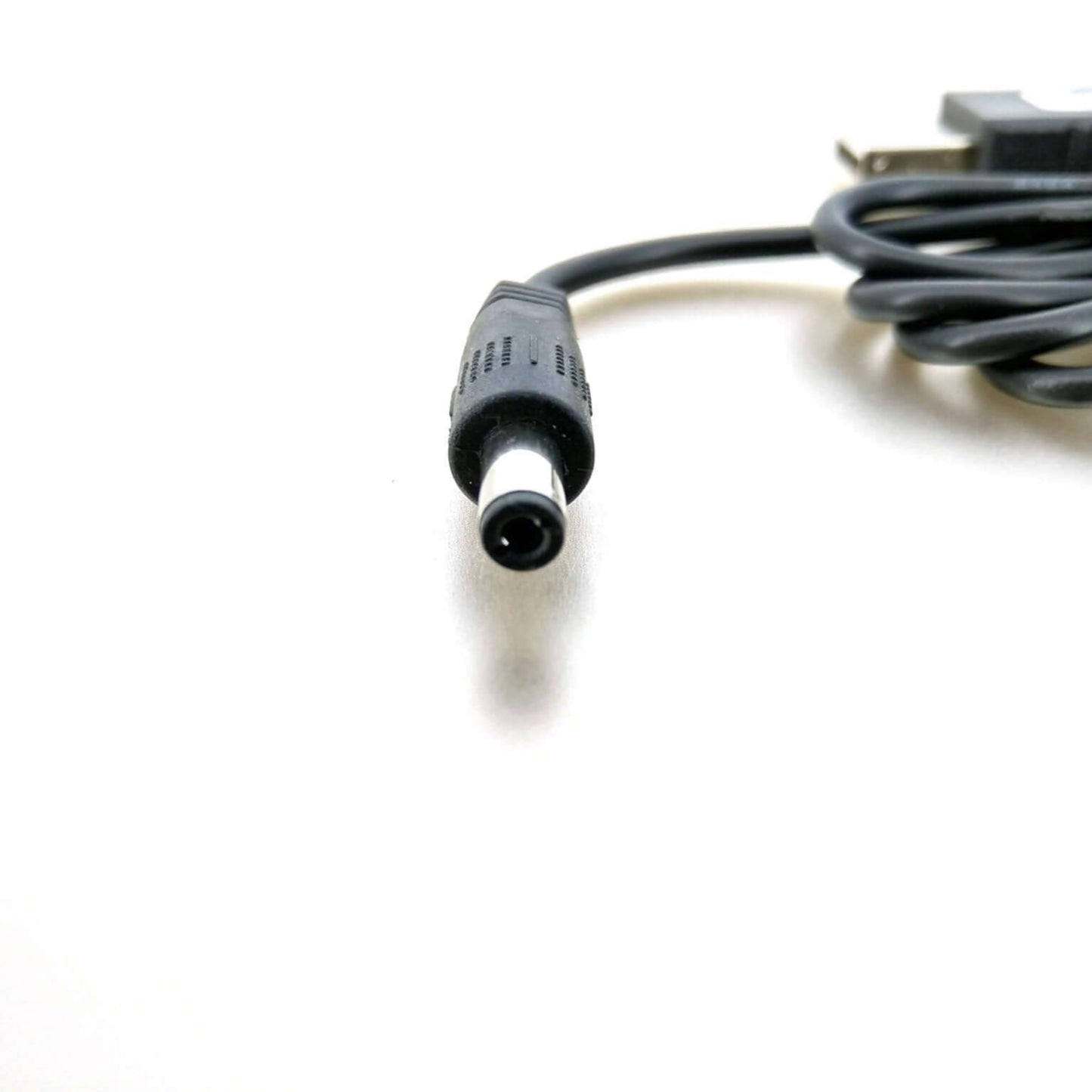 Close-up of USB 5V to 9V Step-Up Converter Cable with 5.5x2.1mm plug, ideal for powering 9V devices.