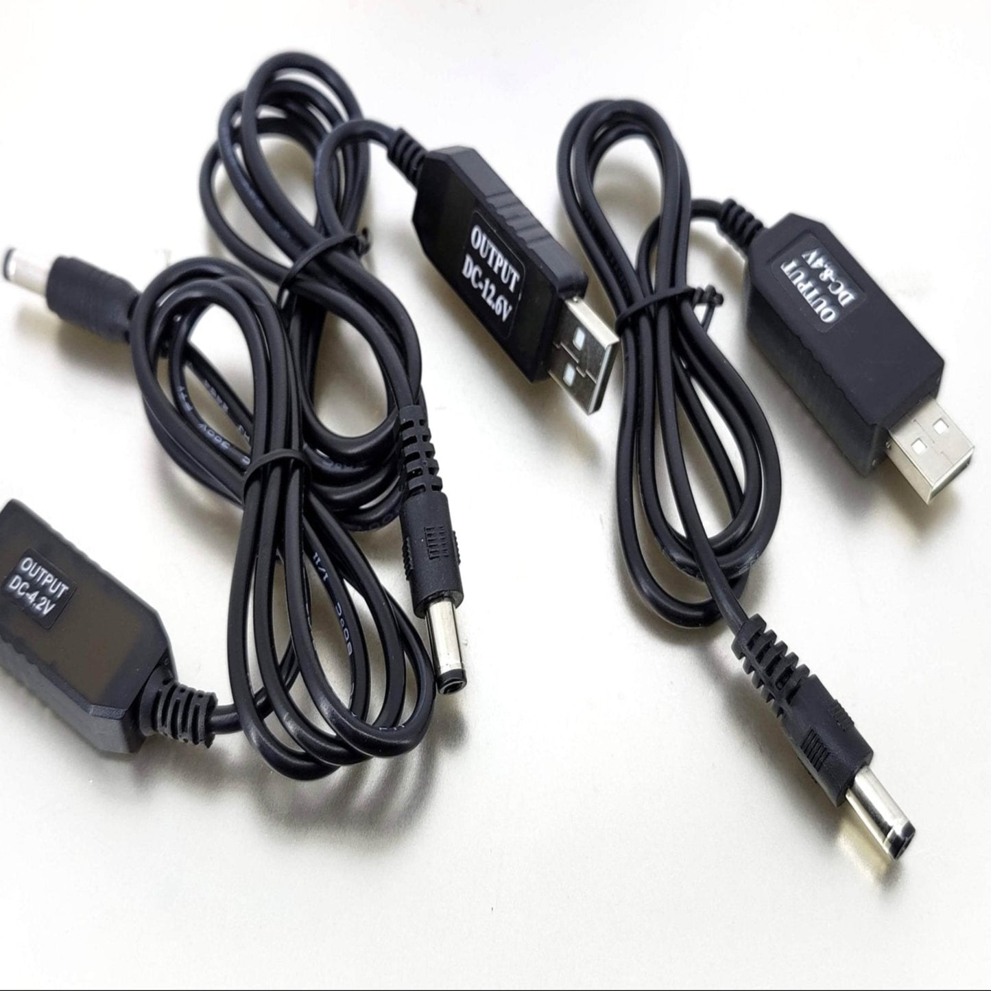 USB to 4.2V 8.4V 12.6V charging cables for 18650 lithium battery packs, featuring multiple output options.
