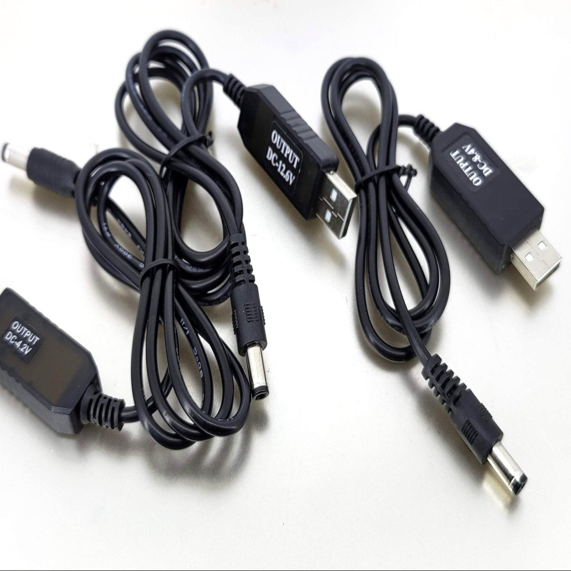 USB to 4.2V 8.4V 12.6V charging cables for 18650 lithium battery packs, featuring multiple output options.