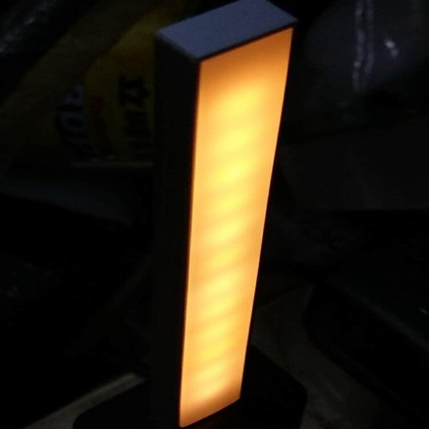 Portable USB Stick LED Light with warm glow, ideal for workspace and travel, featuring a sleek design and touch dimming switch.