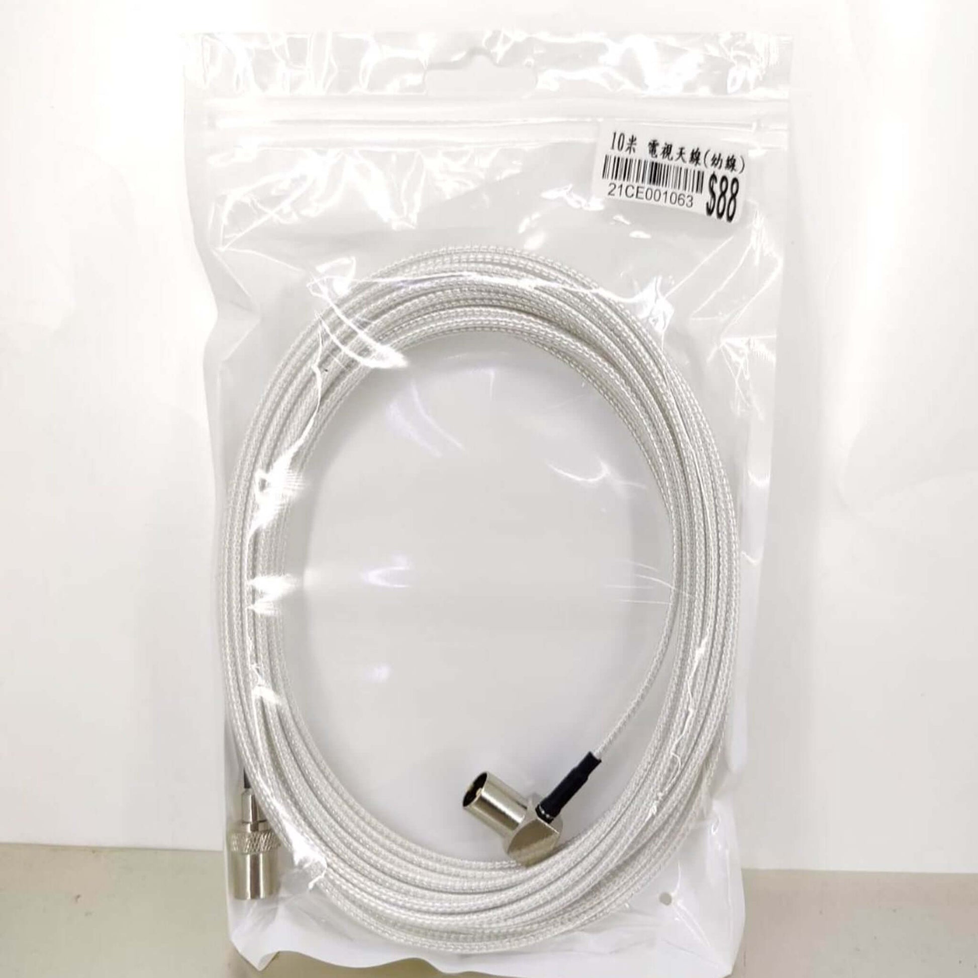 10 meter white coaxial TV antenna cable with one straight and one right-angle connector. Durable signal cable.