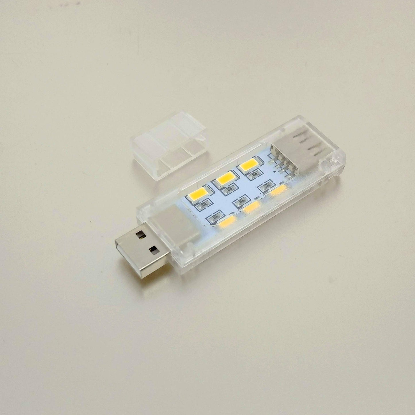 Side-angle view of the 12-LED USB night light, highlighting the stackable female USB port on the end.