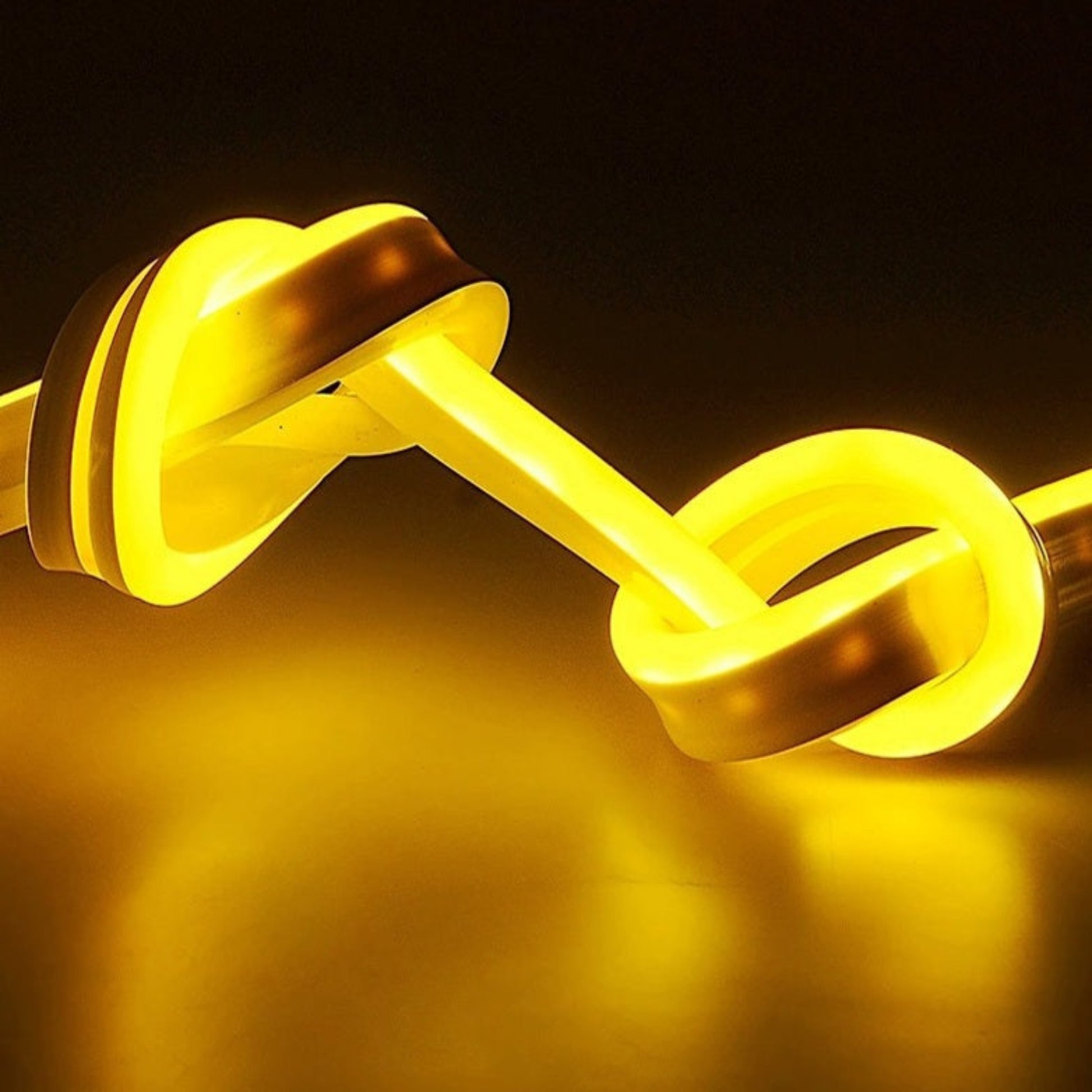 Close-up of the yellow flexible LED neon strip, demonstrating its bendable and knot-friendly design.