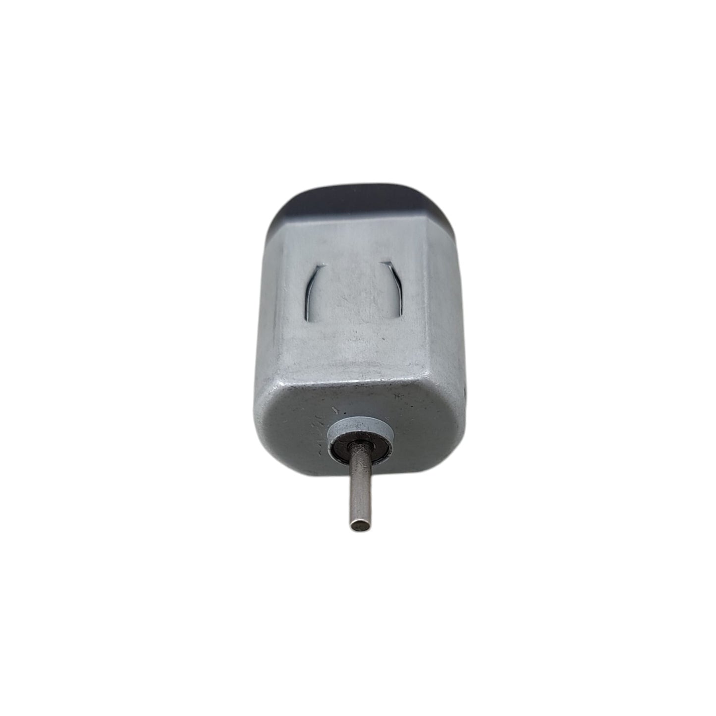 Top-down view of miniature DC hobby motor for electronics projects.