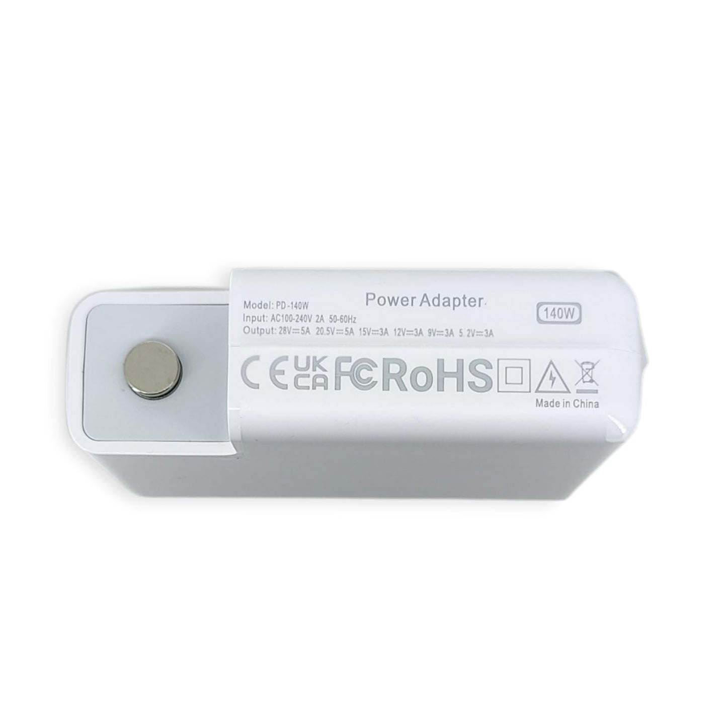 Close-up of the 140W PD-140W power adapter's specifications label showing 140W output and safety certifications.