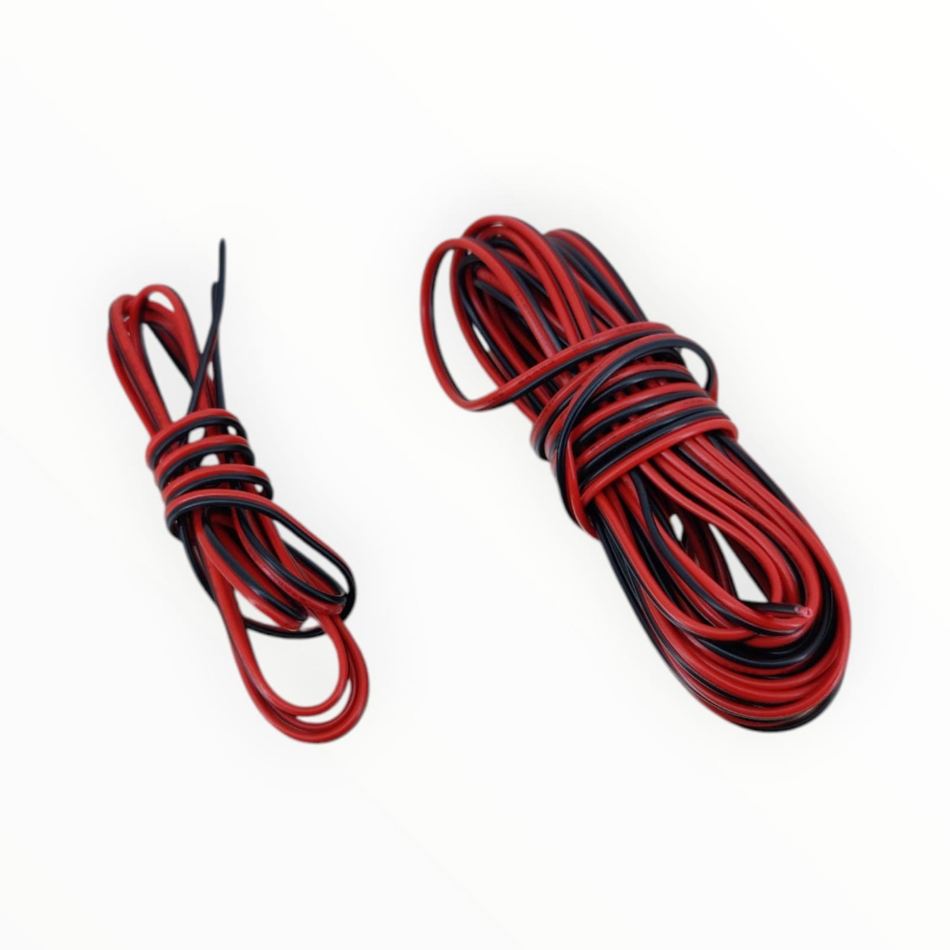 A coiled roll of 24AWG red and black zip wire, showing the flexible PVC insulation and tinned copper conductor.