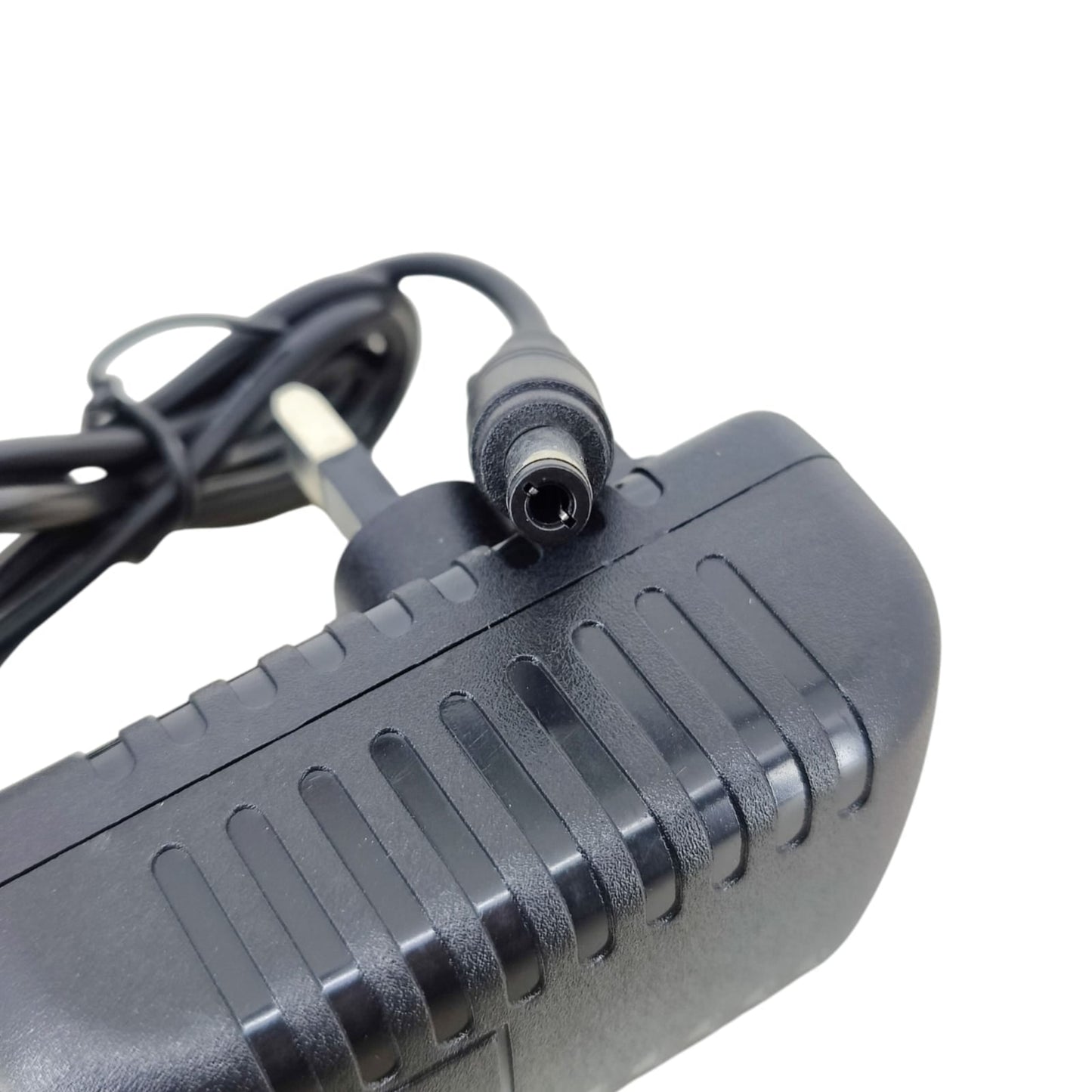 Close-up macro shot of the 5.5mm x 2.1mm DC barrel connector plug for the 28V 1A power adapter.