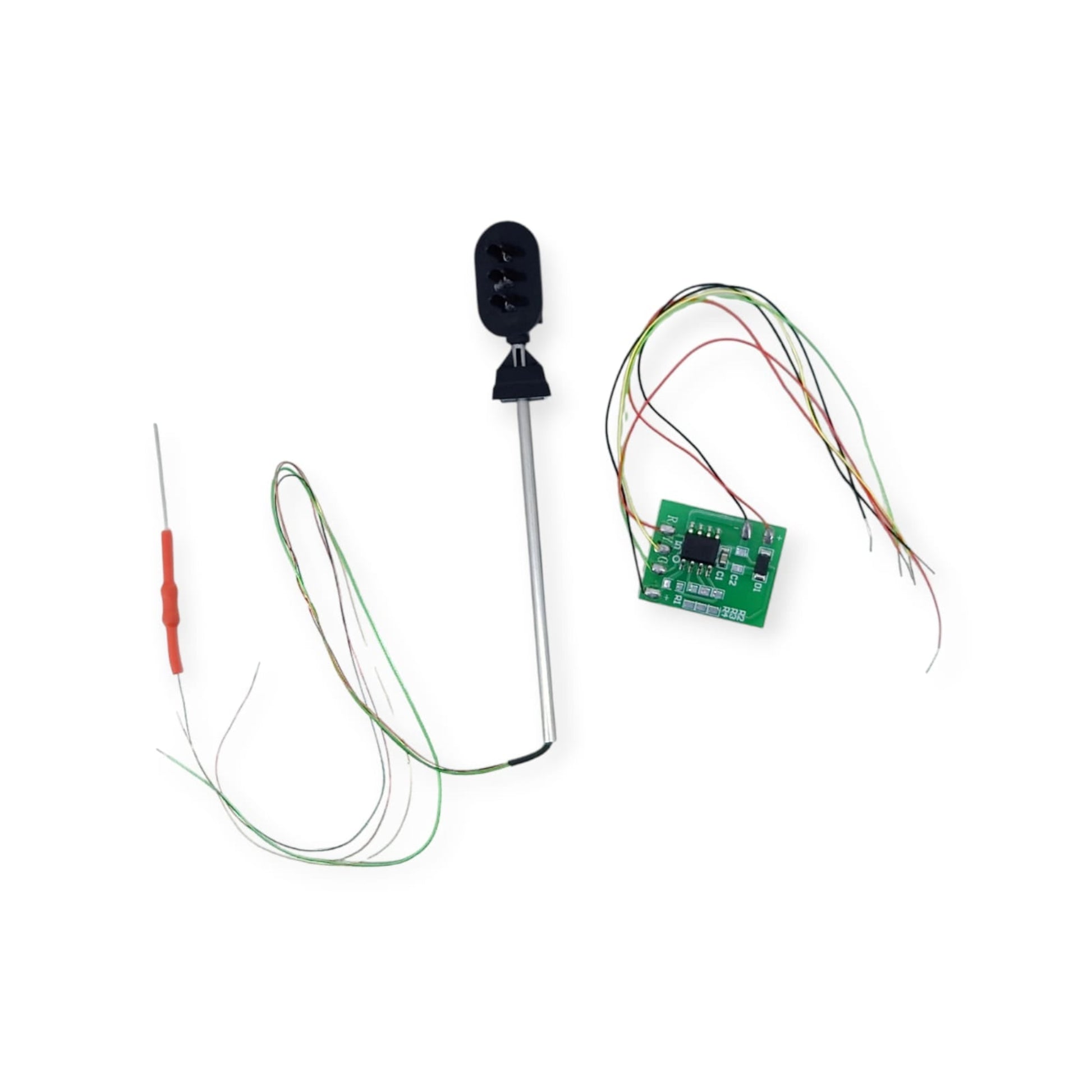 A 3-aspect miniature traffic signal light next to its controller circuit board and adjustment tool.