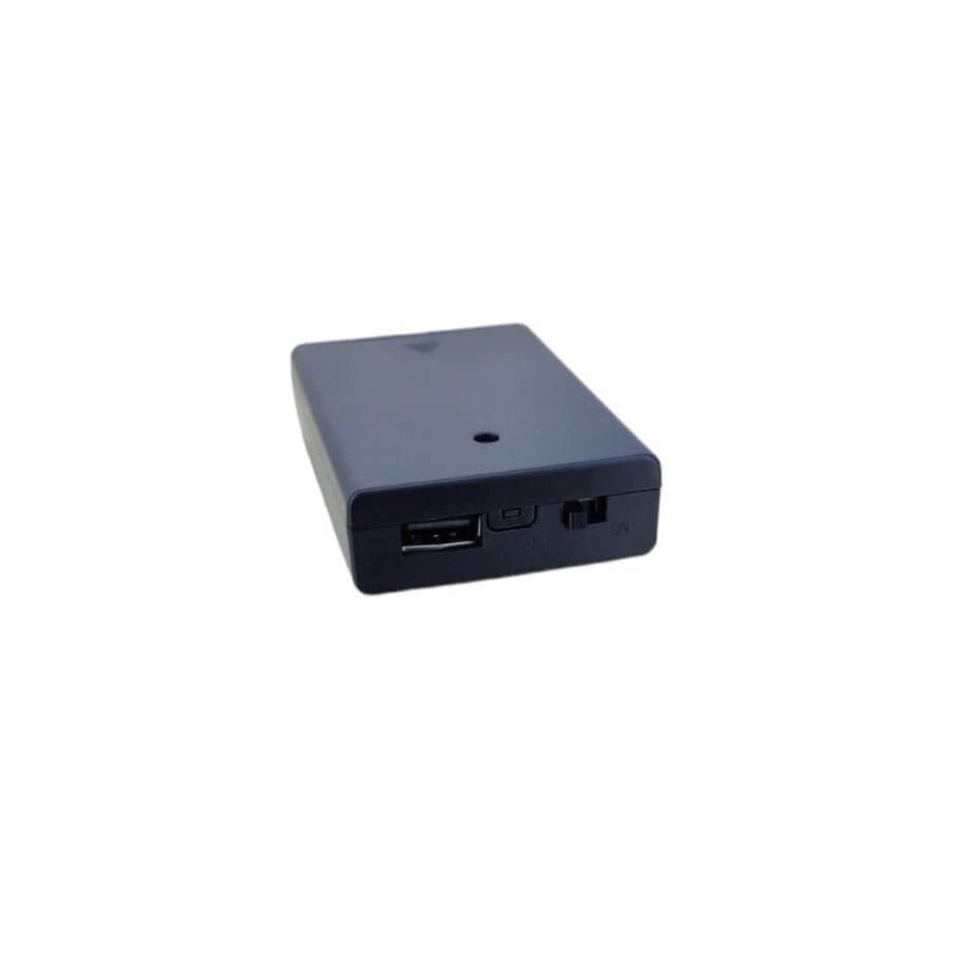 Black 3xAA battery holder showing the USB-A port, a small button, and the on-off power switch on the side.
