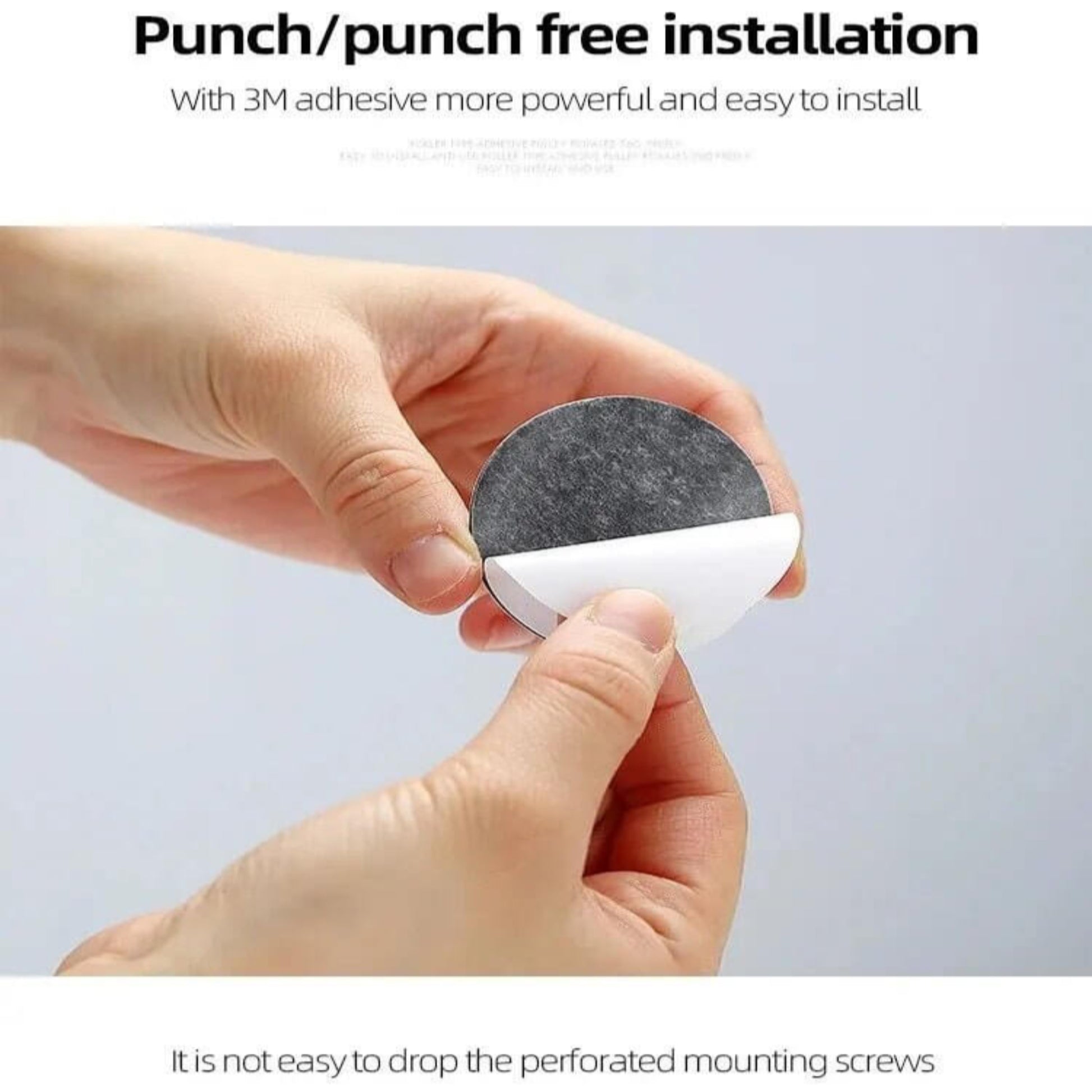 Hands peeling off the 3M adhesive backing from a self-adhesive ball wheel for punch-free installation on furniture.