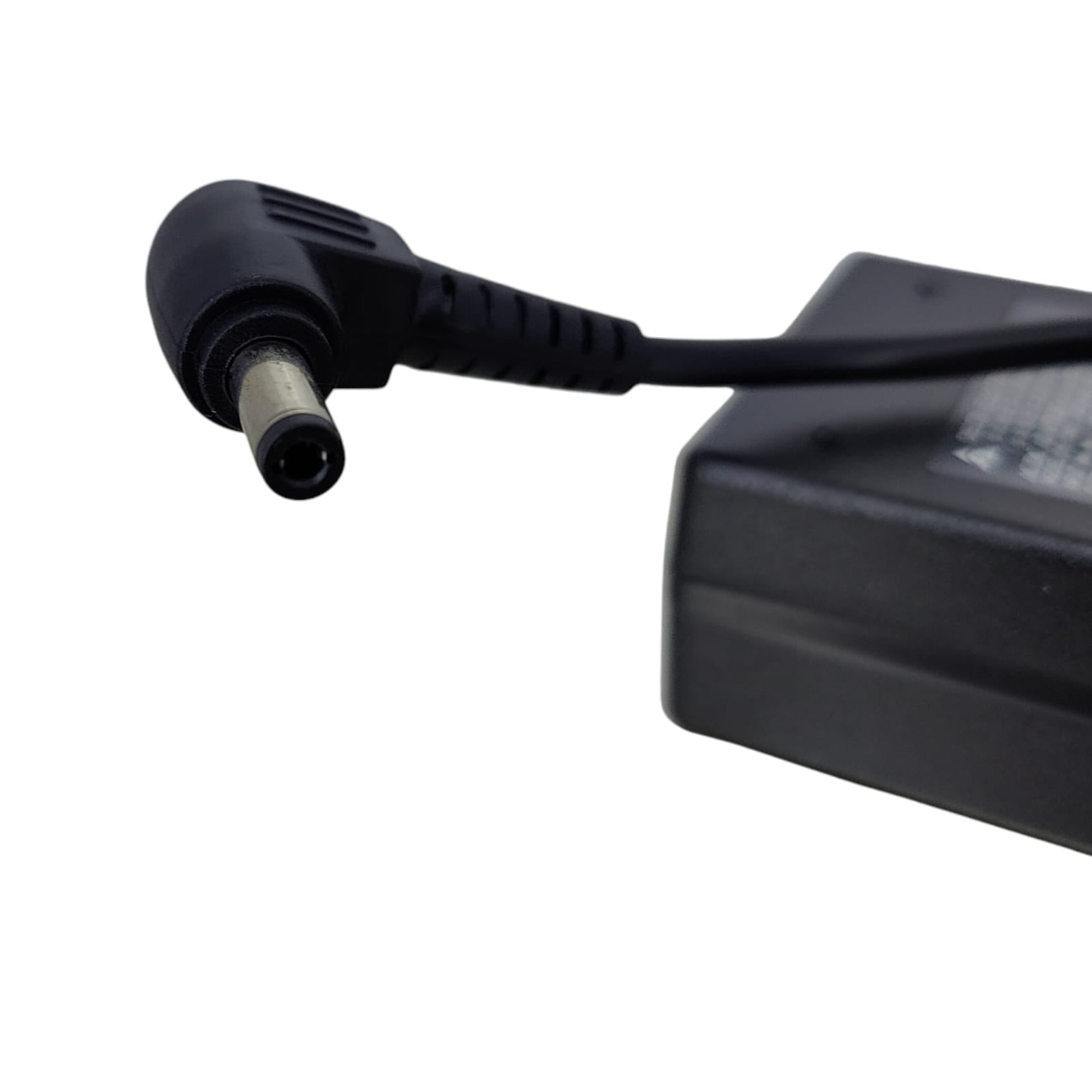 Detail shot of the 5.5mm x 2.5mm right-angle connector tip for laptop power supply.