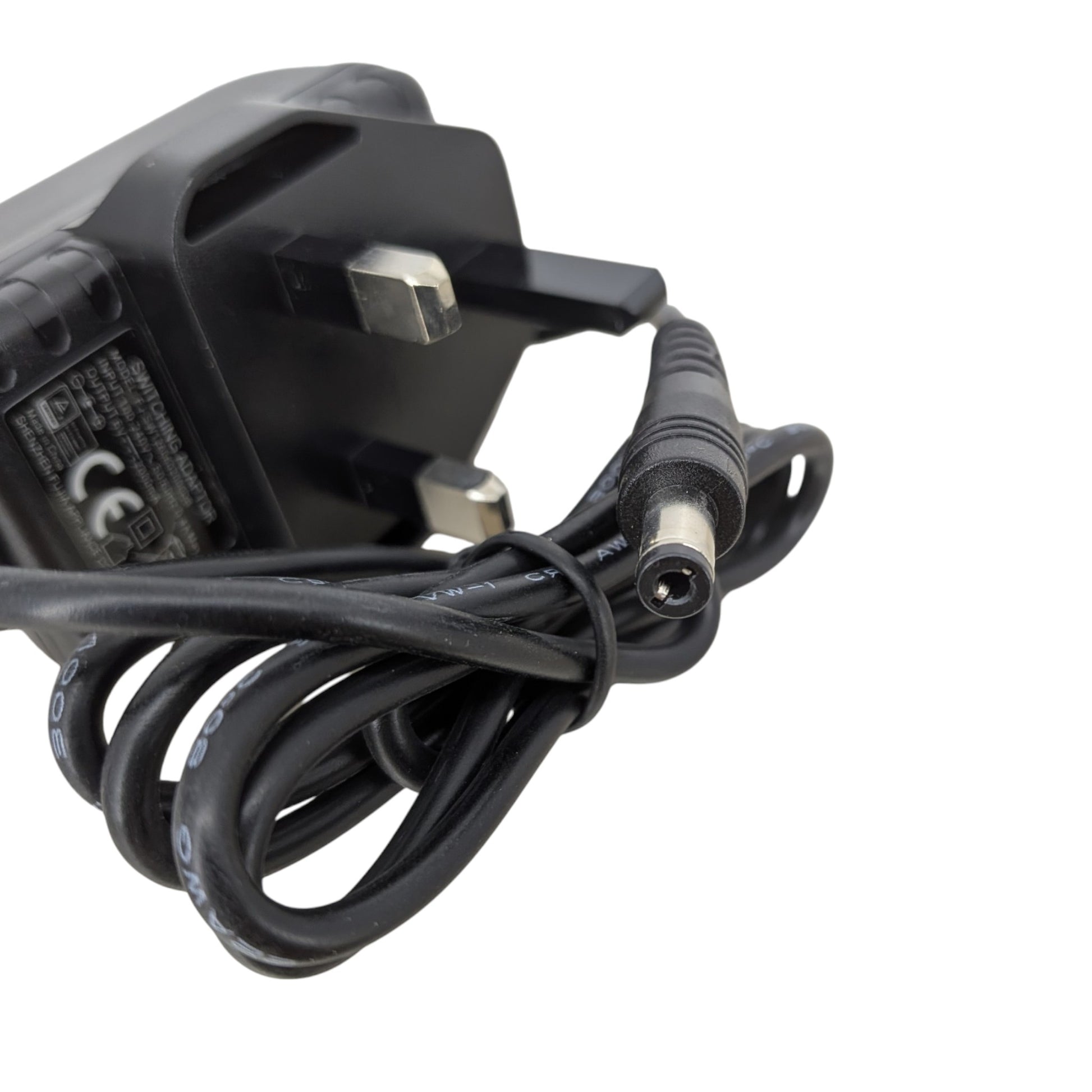 The 5.5mm x 2.1mm DC barrel connector of the 6V 2A power adapter, compatible with blood pressure monitors and baby swings.