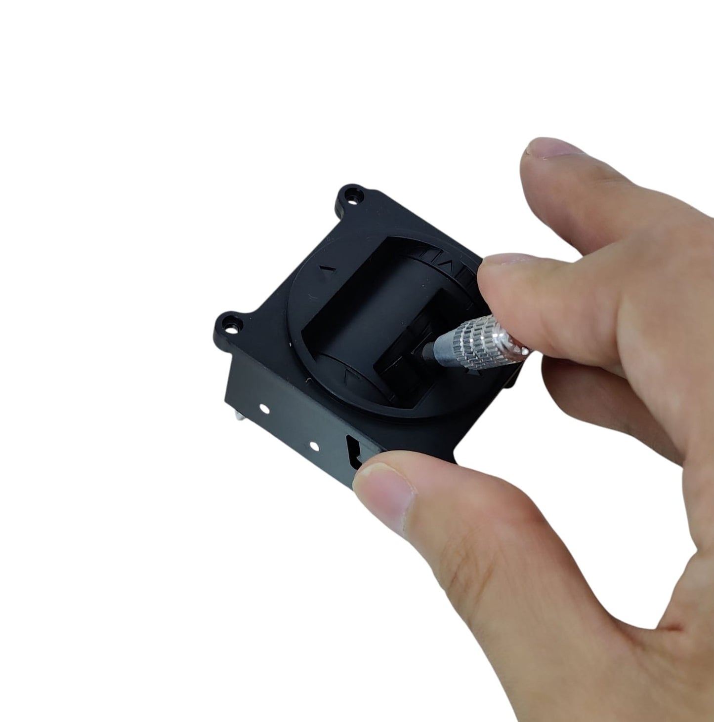 Hand holding the 5K RC joystick and pressing the top push-button on the metal stick.