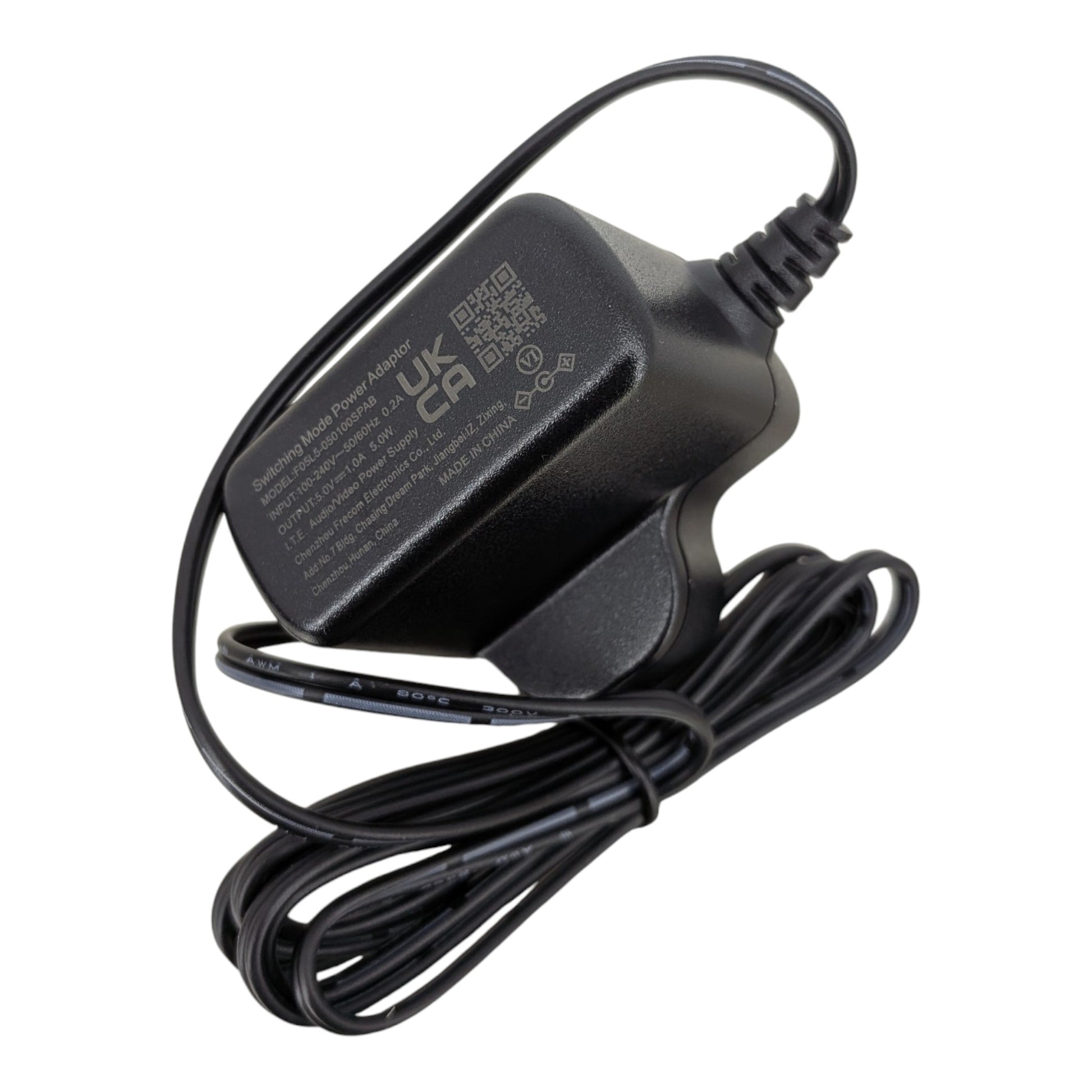 Close up of the 5V 1A switching adapter label showing 100-240V input, 5W output, UKCA certification, and Level VI efficiency rating.