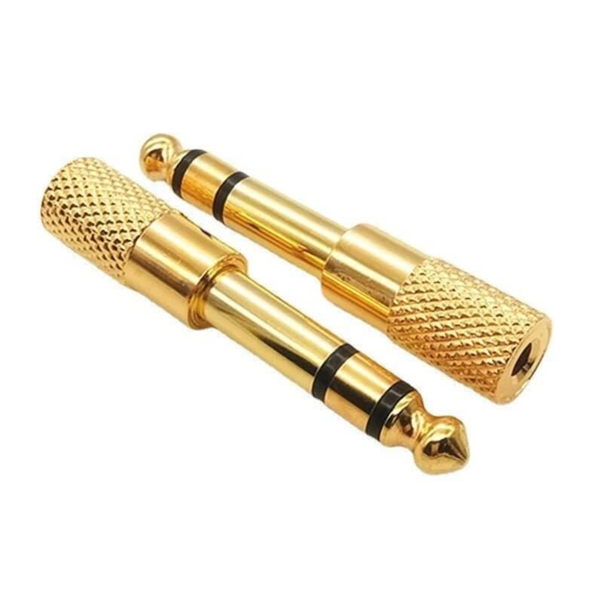 Gold 3.5mm to 6.35mm audio adapter plugs for connecting headphones and audio equipment.