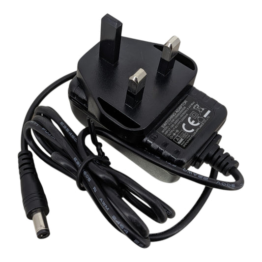 Top view of the 6V 2A AC power adapter showing the standard UK 3-pin plug and durable black casing.