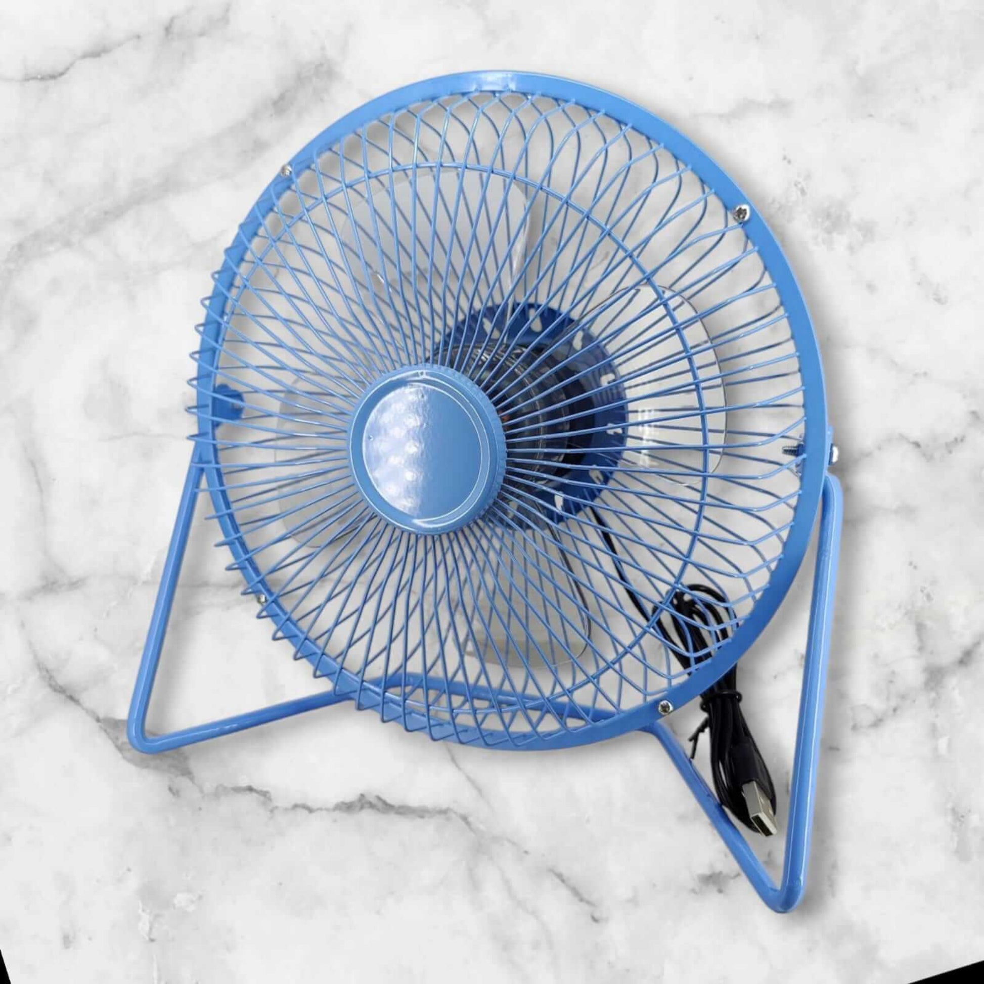 8-inch USB desk fan in blue against a marble background, designed for quiet and powerful cooling on-the-go.