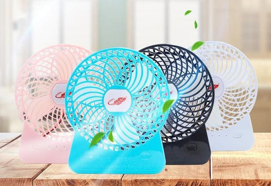 Collection of portable fans in pink, blue, black, and white