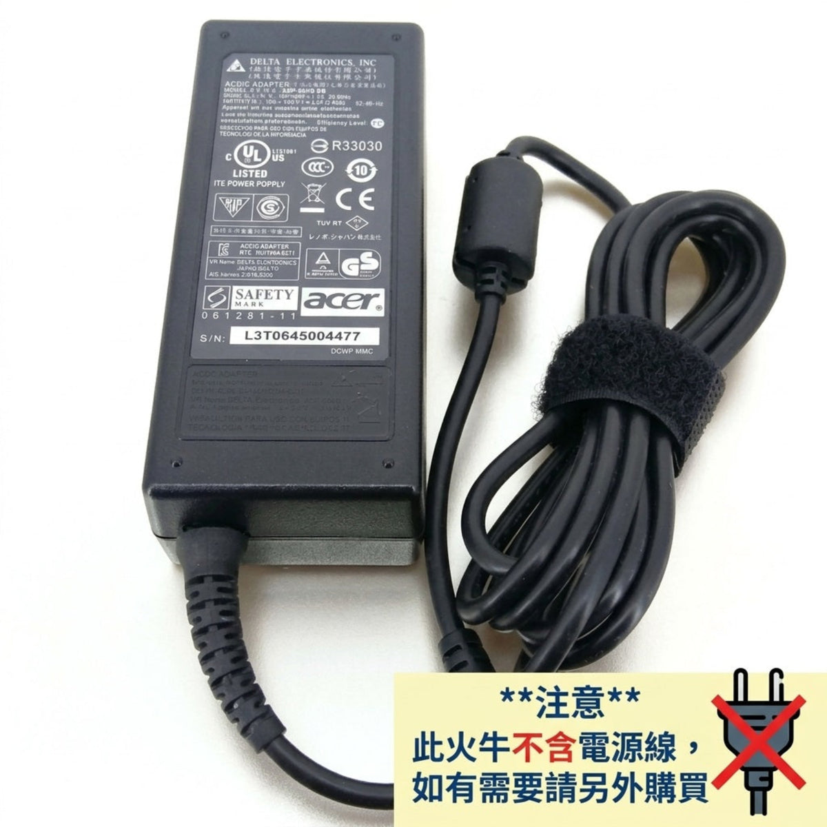 Acer laptop power adapter with a black power brick and coiled black cable, shown on a white background with a yellow warning label in Chinese at the bottom right.