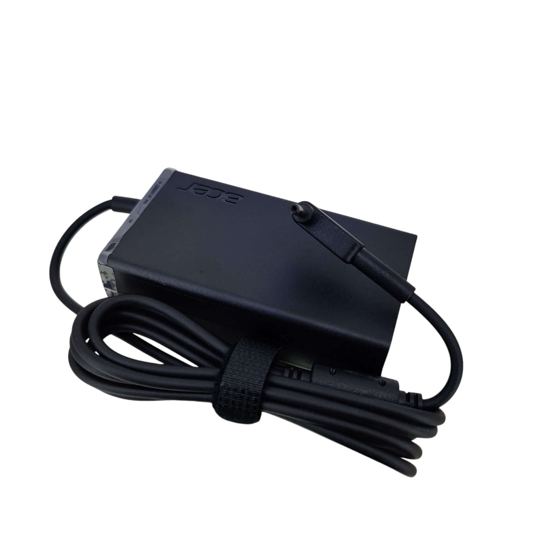 An OEM Acer 65W laptop charger with its 3.0mm x 1.1mm DC connector tip and cable neatly wrapped.