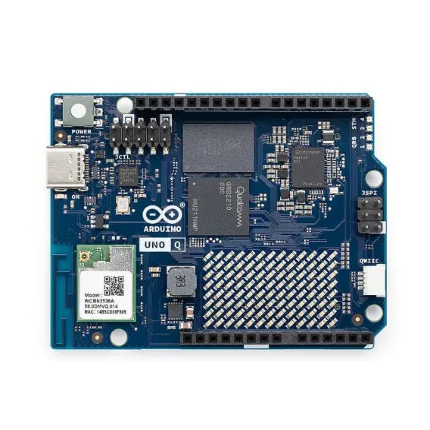 Close up of the STM32 microcontroller and classic UNO headers on the UNO Q board.