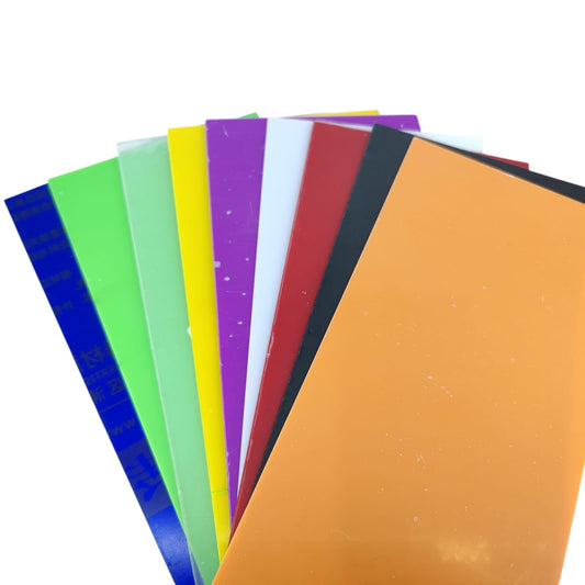 A fanned display of assorted 100x200x2.3mm colored acrylic sheets, highlighting the wide color selection.