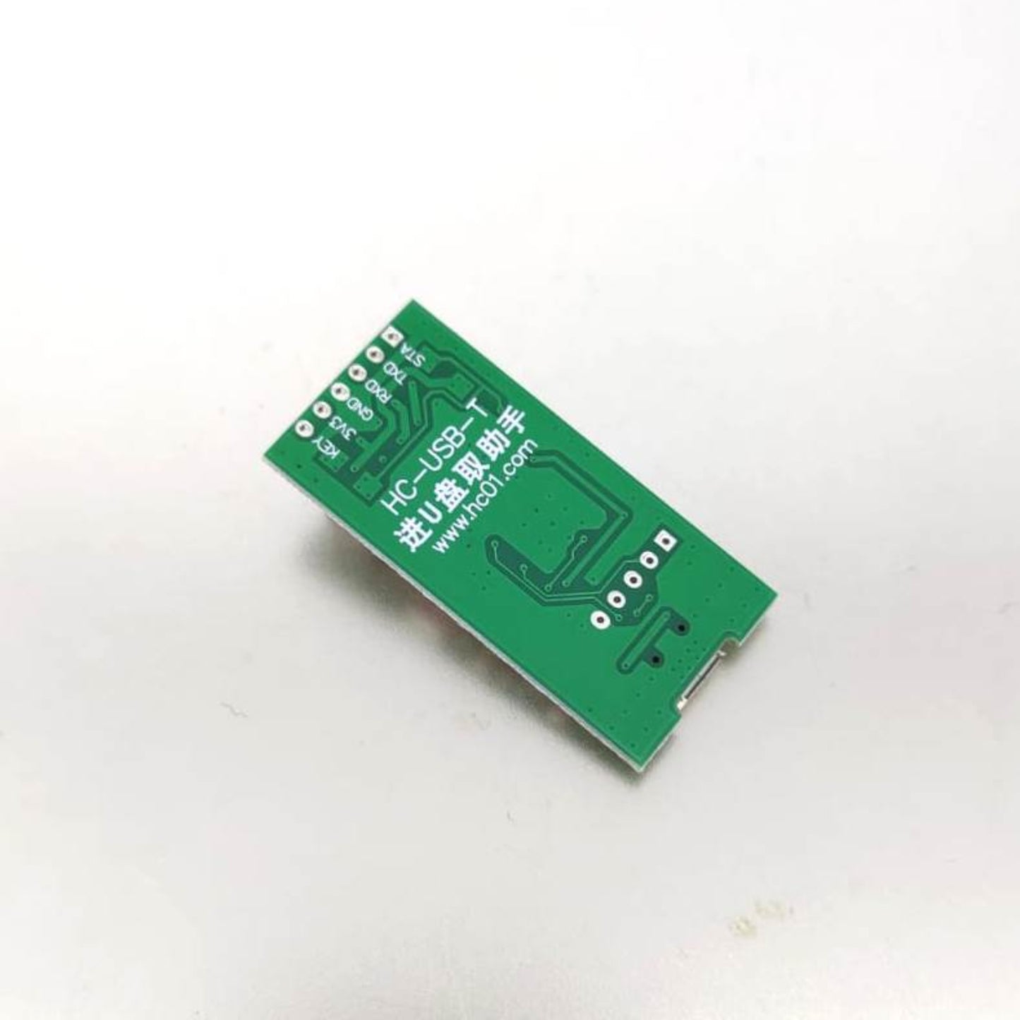 Wiring diagram showing UART cross-connection between the test rack and a Bluetooth module.