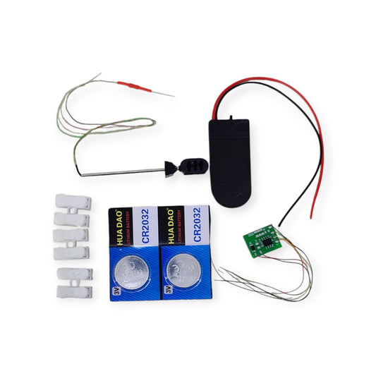 Full kit contents for 6V LED model traffic signal light, including signal head, circuit board, batteries, and battery holder.