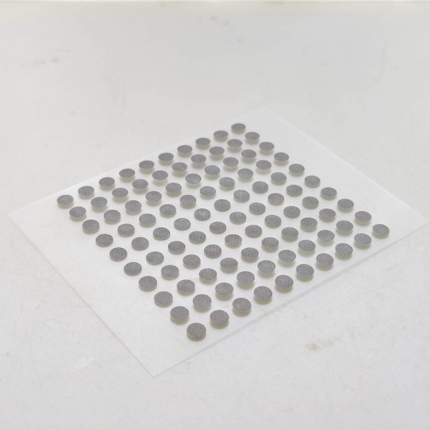 Angled close-up showing the texture of 4mm conductive button pads.