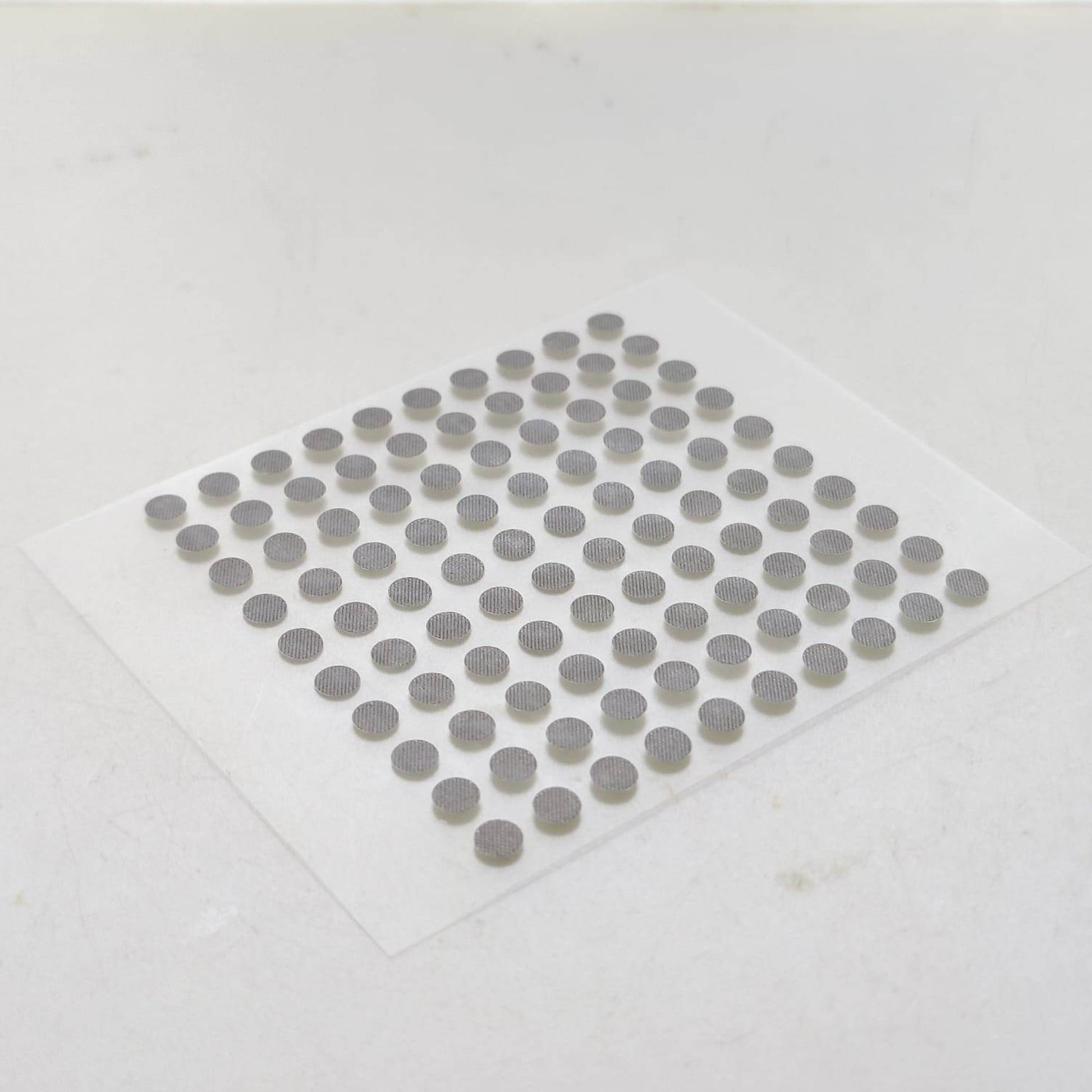 Angled close-up showing the texture of 4mm conductive button pads.