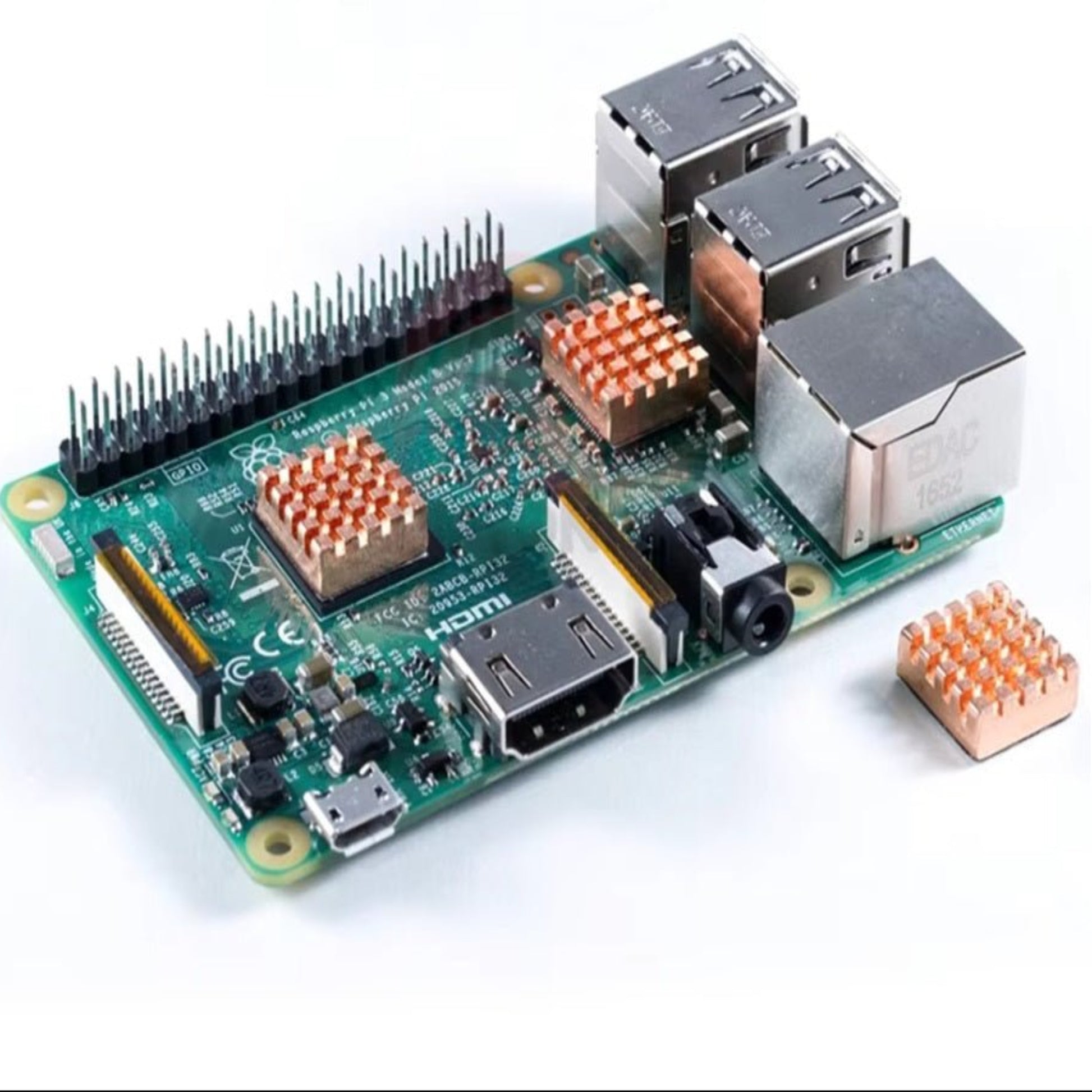 Raspberry Pi 4B with copper heatsinks installed for effective cooling, showcasing its multi-port design.