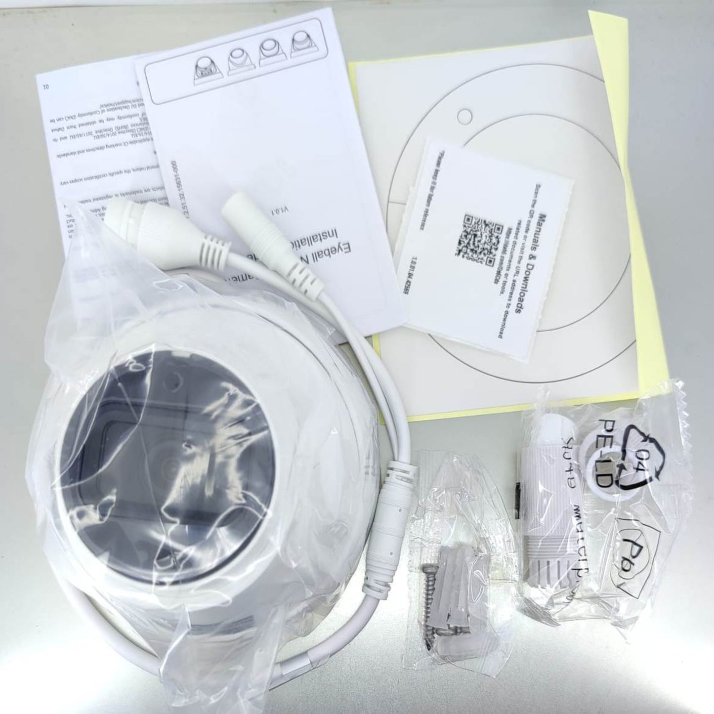 Package contents of Dahua 4MP IP Camera with built-in microphone