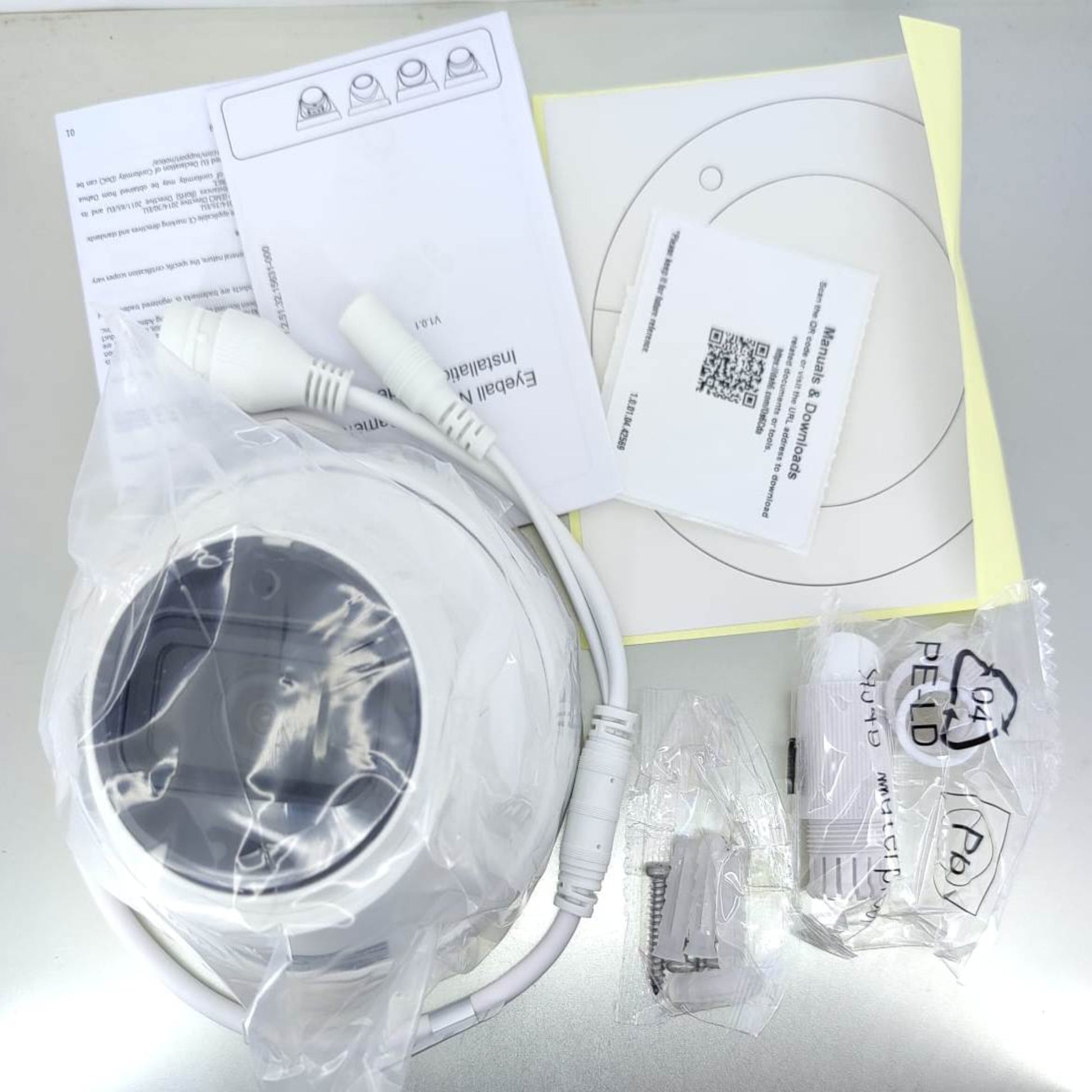 Package contents of Dahua 4MP IP Camera with built-in microphone