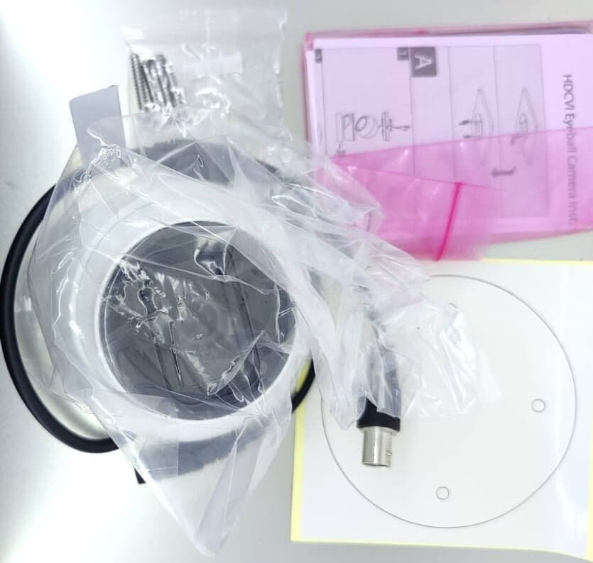Dahua HAC-HDW1500TLM-A camera accessories including mounting hardware and user manual.