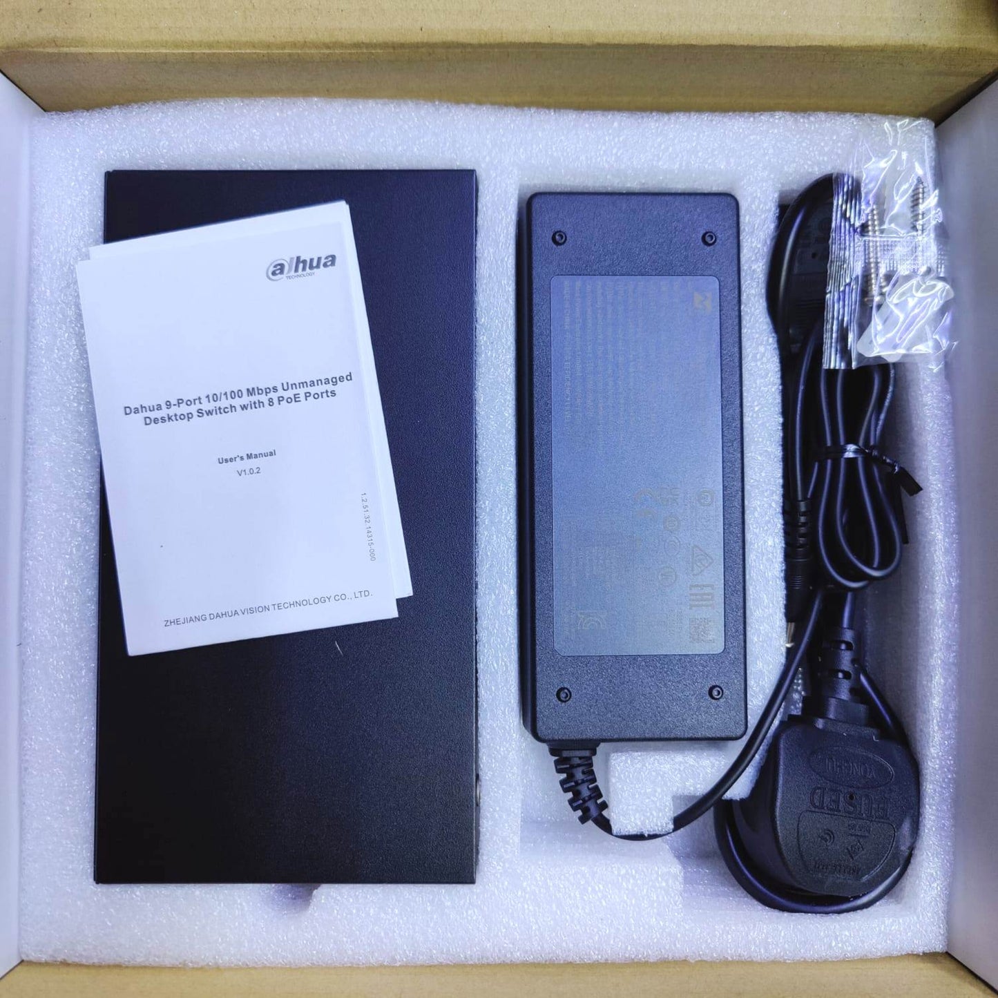 Unboxing Dahua PoE switch with power adapter and manual included