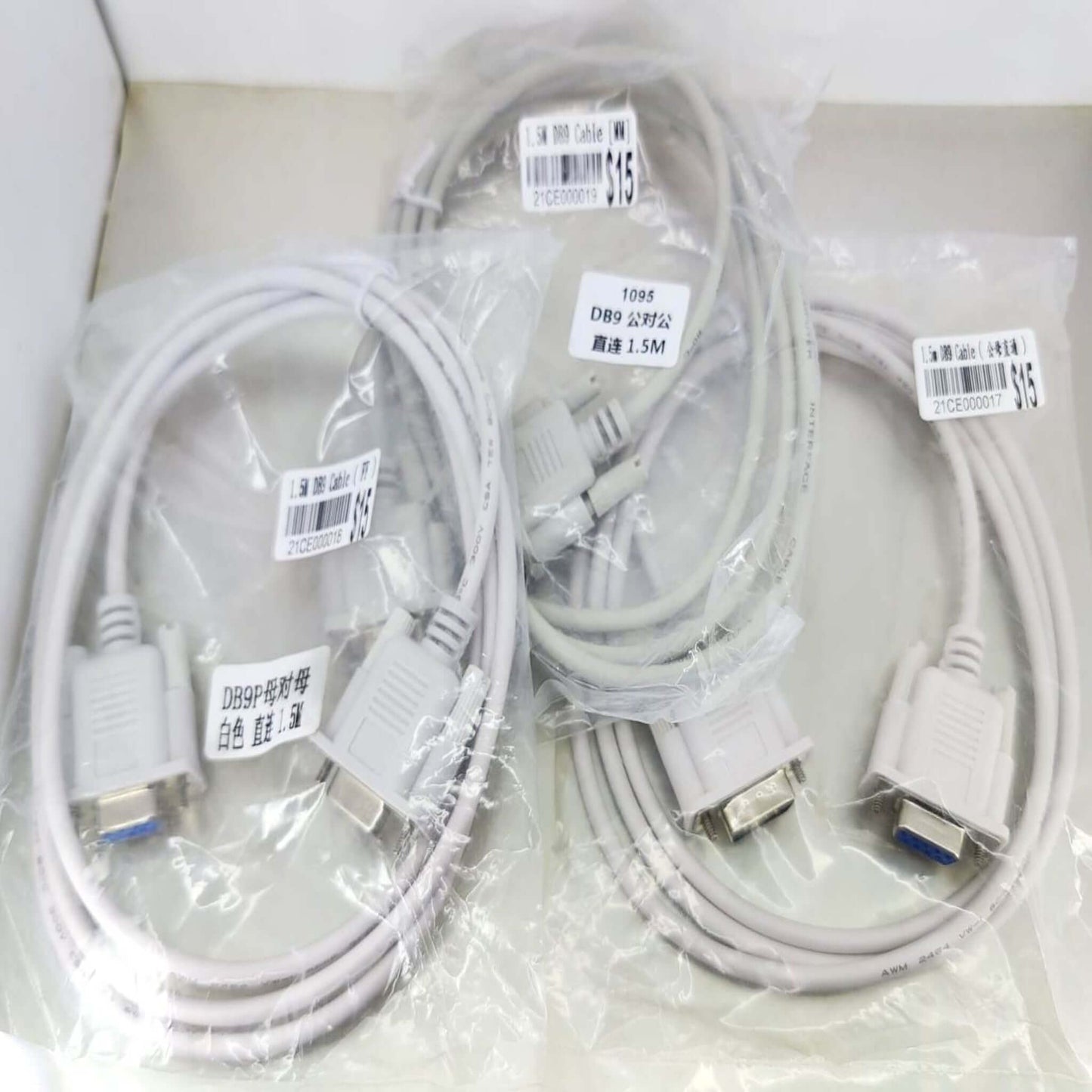 Three DB9 RS232 serial cables in packaging, including 1.5-meter options for versatile connectivity.