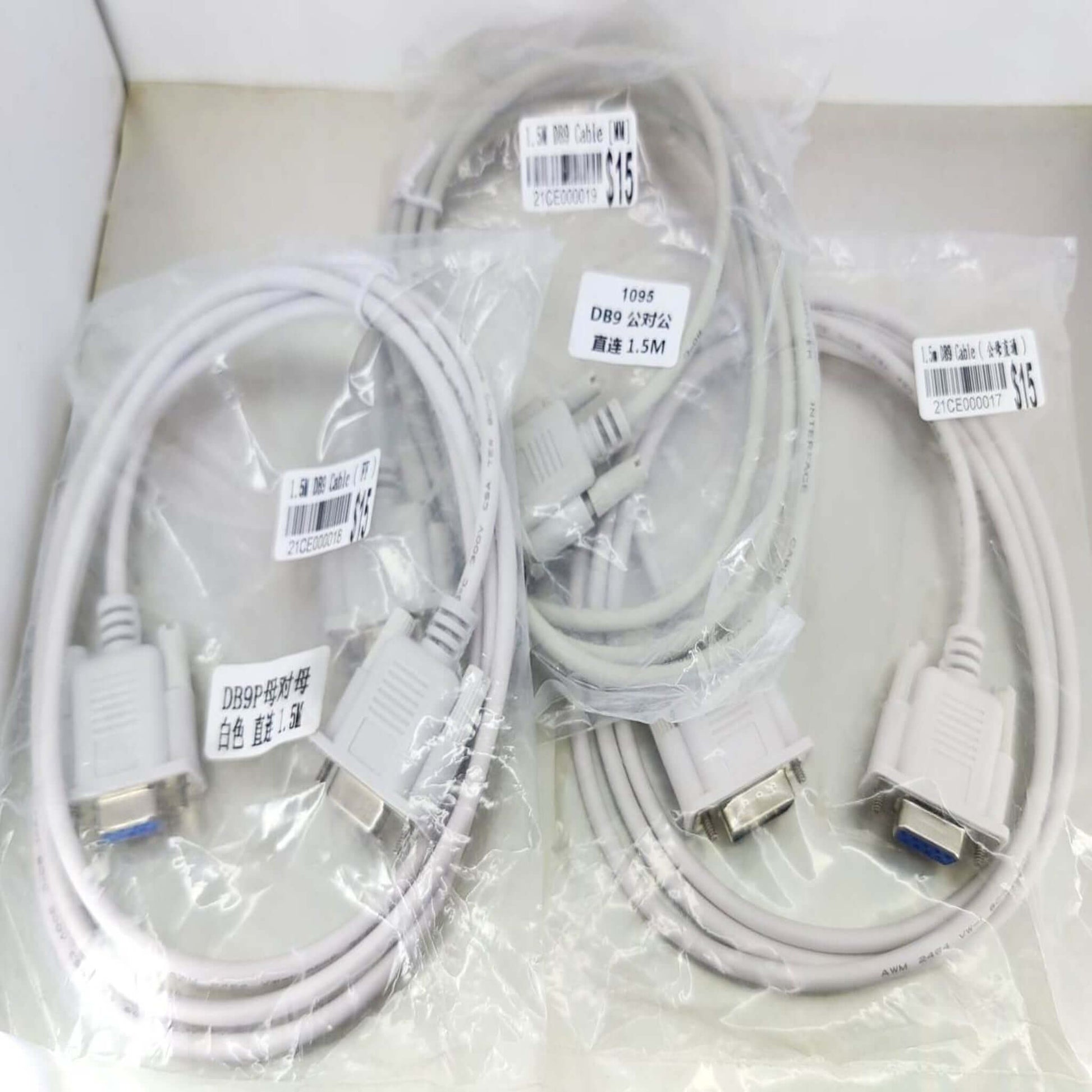 Three DB9 RS232 serial cables in packaging, including 1.5-meter options for versatile connectivity.