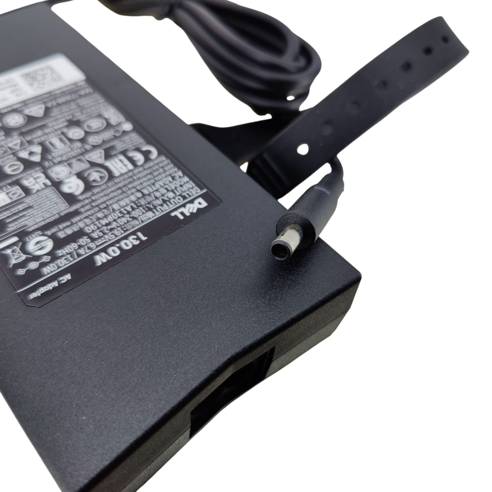 Side view of the Dell 130W charger, highlighting the output cable, DC tip, and attached cable management strap.