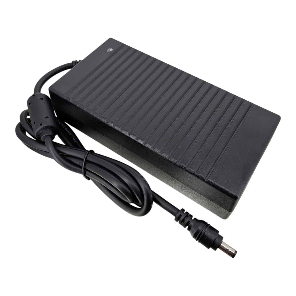 A black rectangular power adapter with a ribbed top surface, attached to a coiled black power cord with a barrel plug, shown on a plain white background.