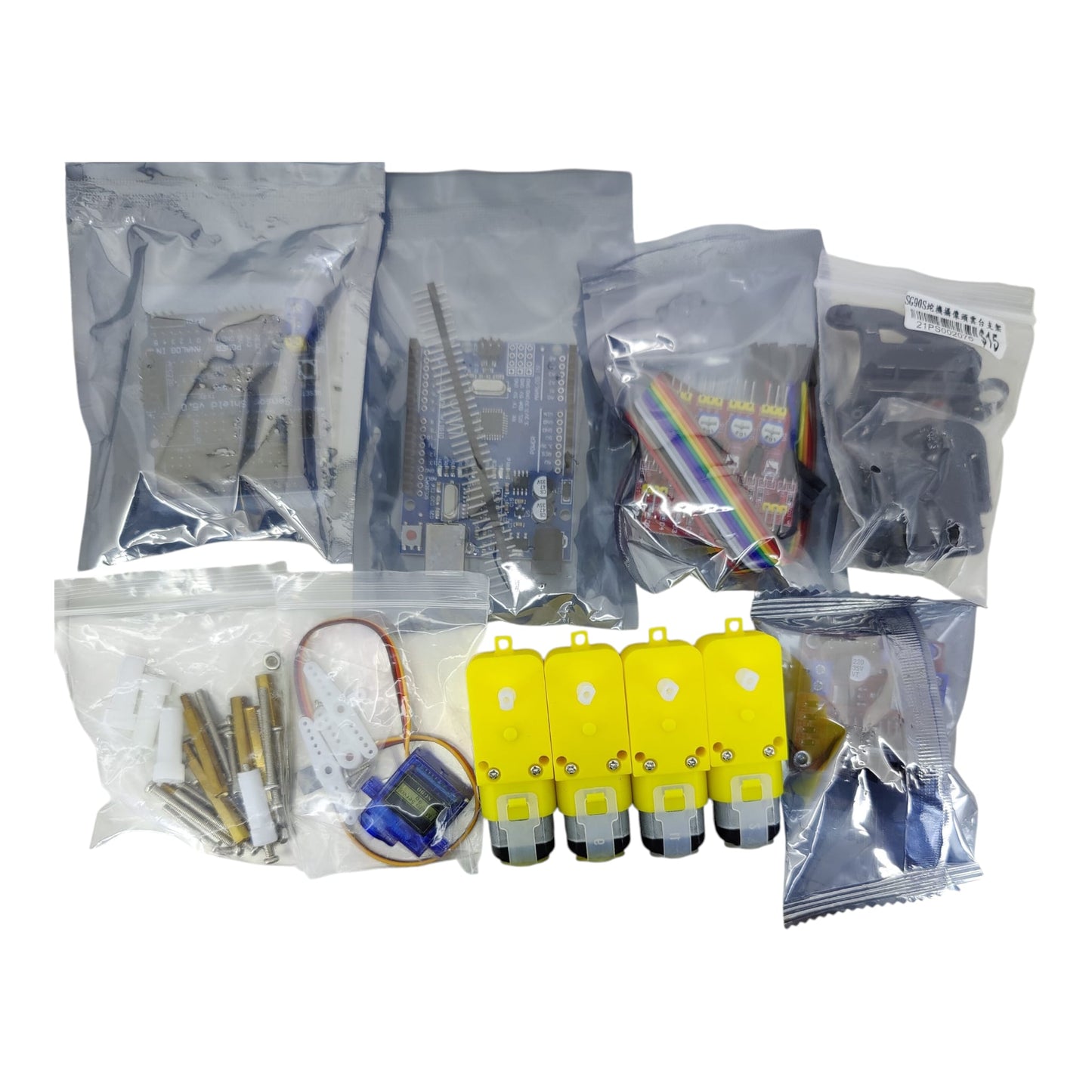 Unboxed DIY robotics kit showing individually packaged motors, jumper wires, and hardware components.