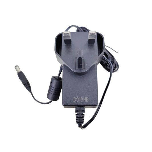 UK plug 9V 2A switching adapter for guitars and keyboards, center negative polarity, 5.5mm connector.