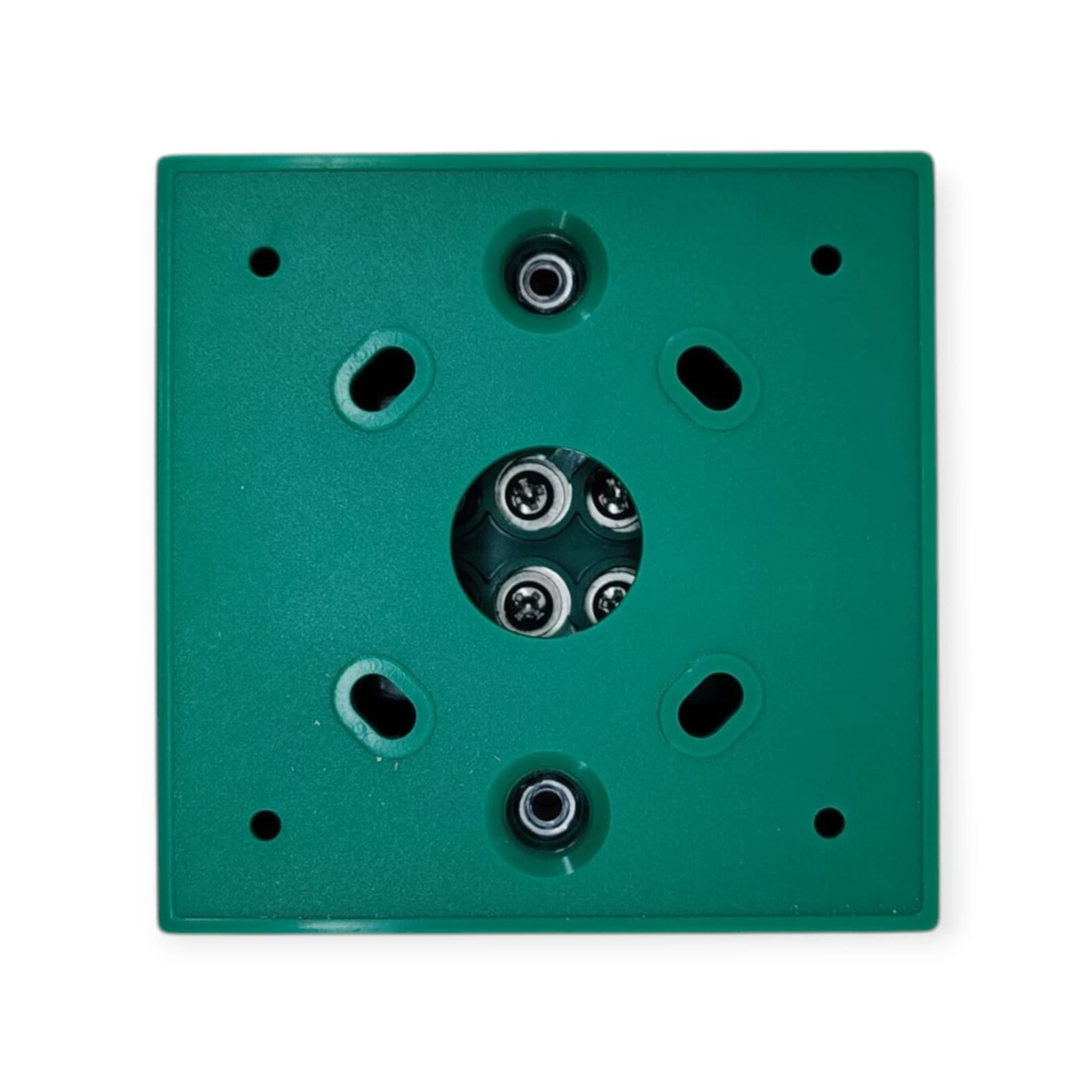 Rear view of the emergency door release switch showing the NO, NC, and COM wiring terminals.