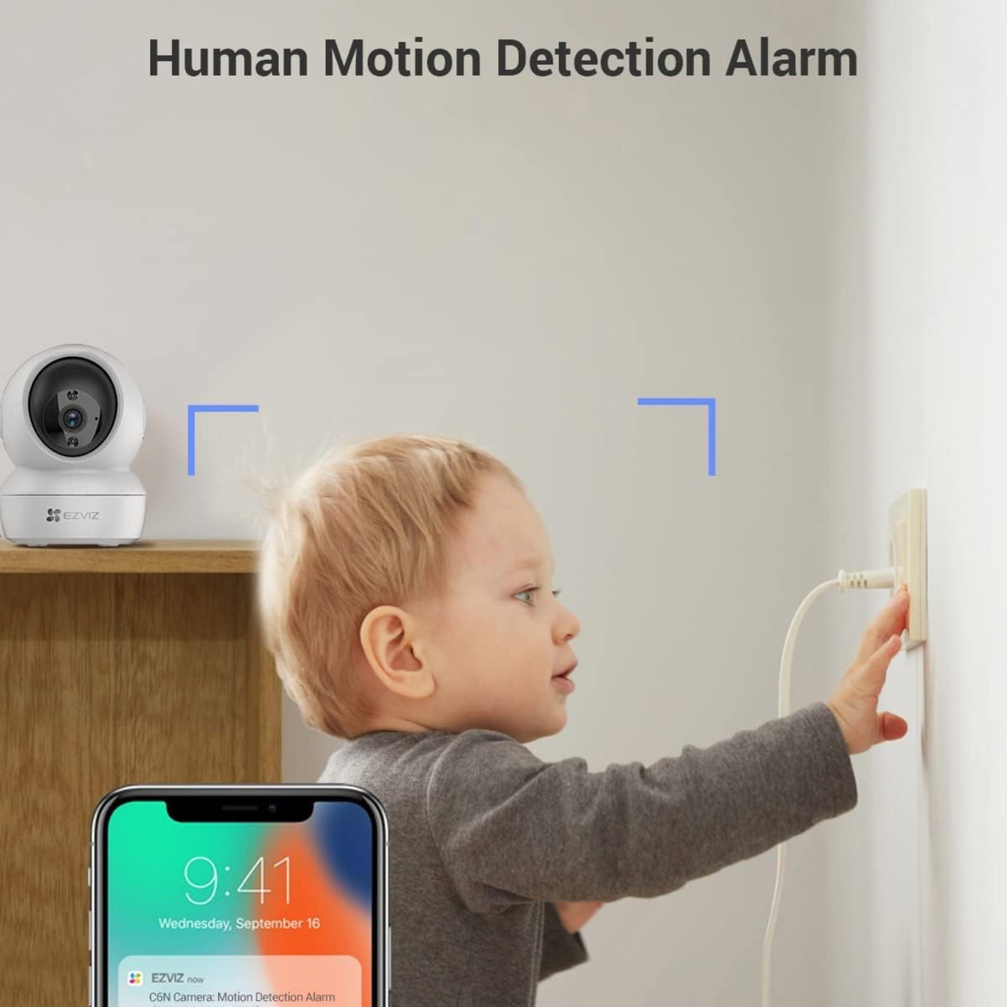 Human motion detection alarm on EZVIZ H6c Pro sending a smartphone alert when a toddler touches a wall socket.