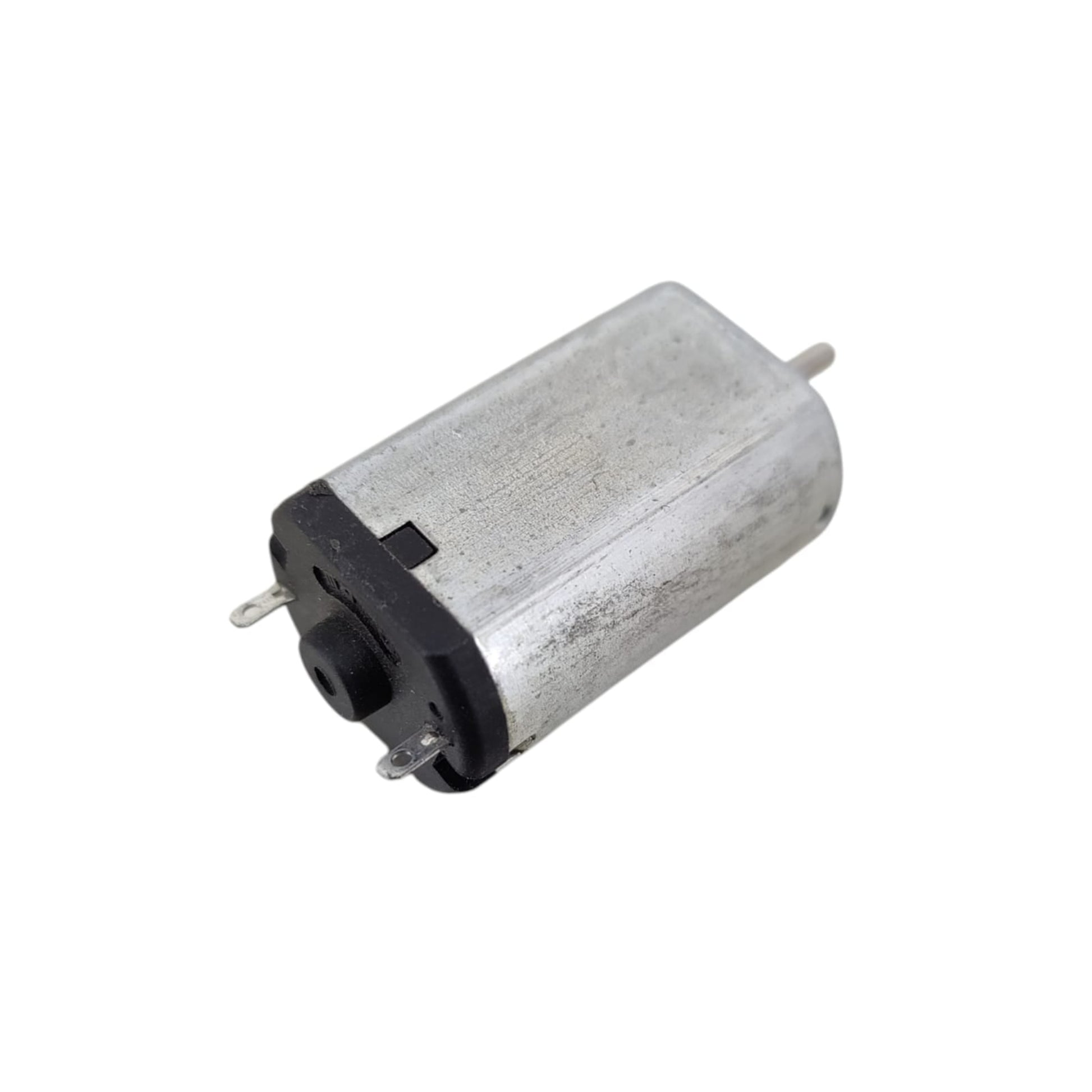 Small cylindrical motor on a white background