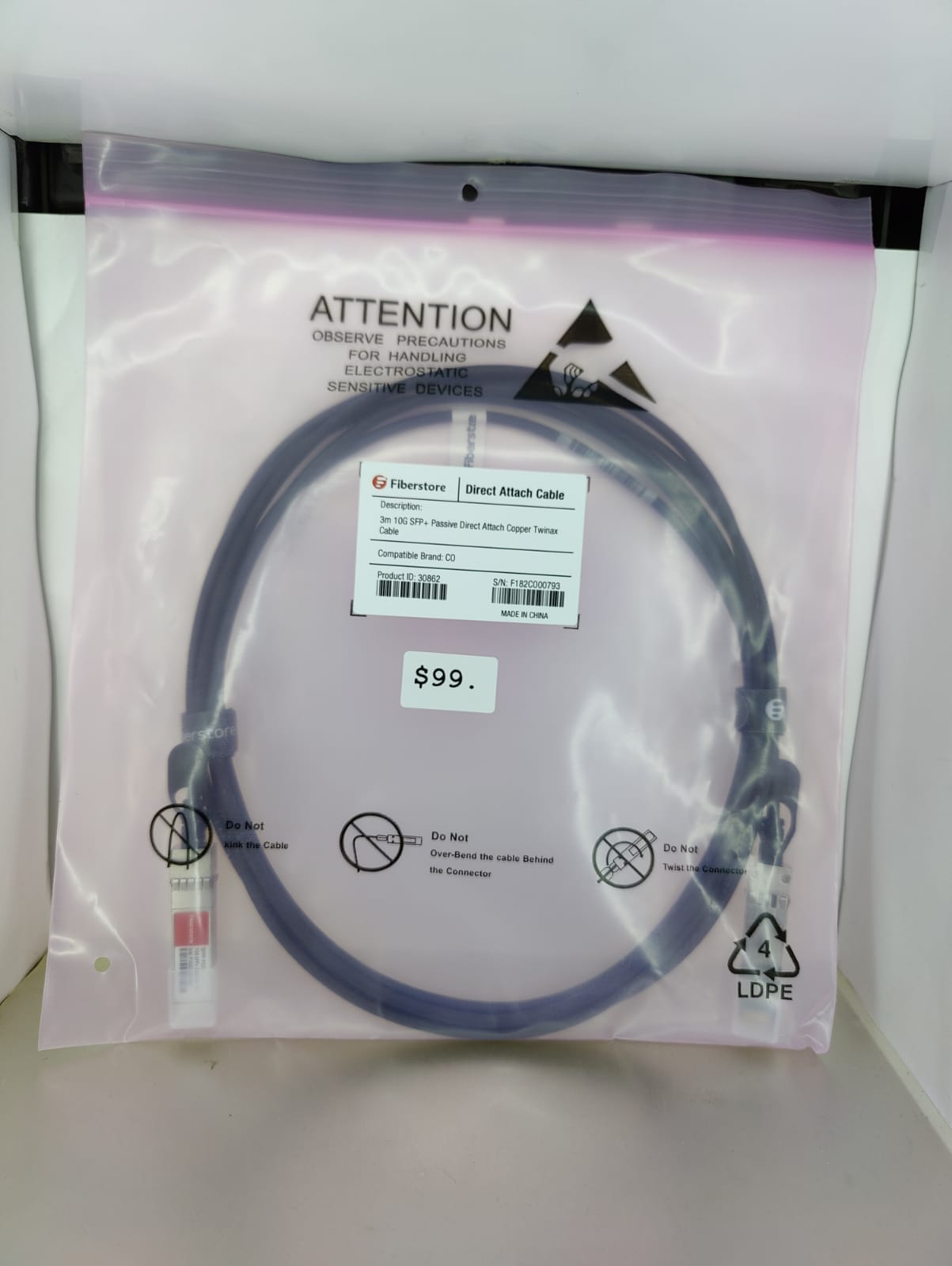 Fiberstore 10G SFP+ DAC Twinax Cable in protective packaging, 3M length, ideal for short-distance data center connections.