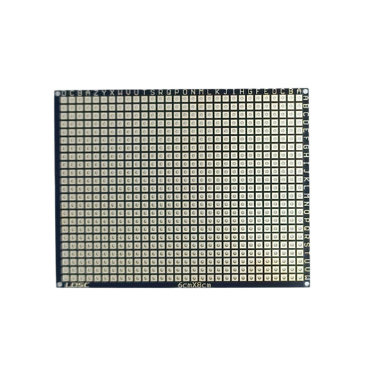 Top down view of a 6x8cm flexible PCB prototype board with a black finish and gold-plated pads.