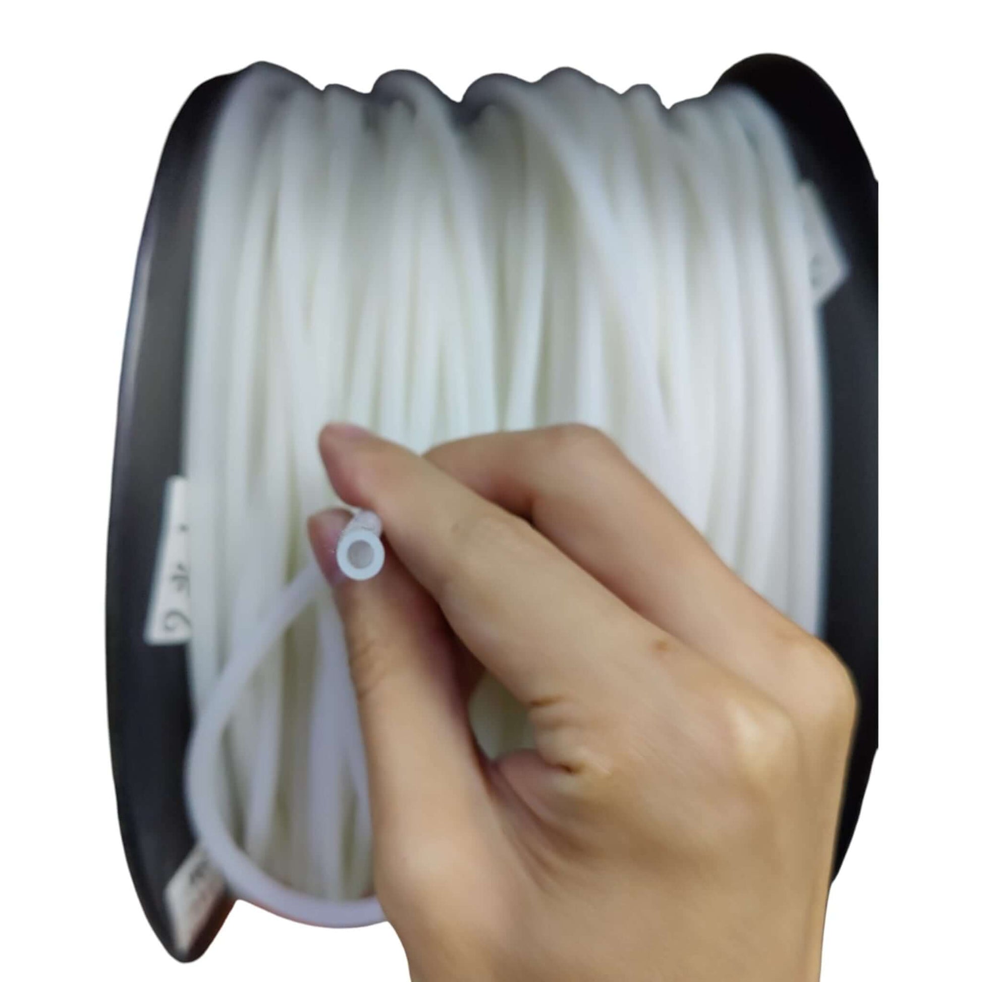 Hand holding 3mm ID silicone tube showing wall thickness and flexibility