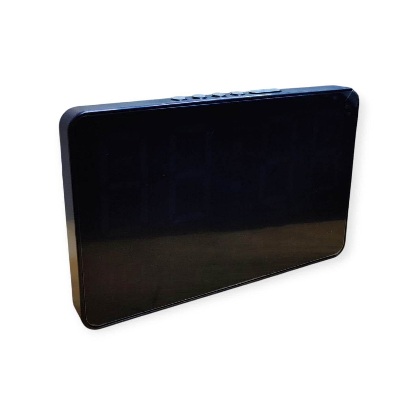 Side and top-angle view of the sleek black digital clock, highlighting the row of control buttons along the top edge.
