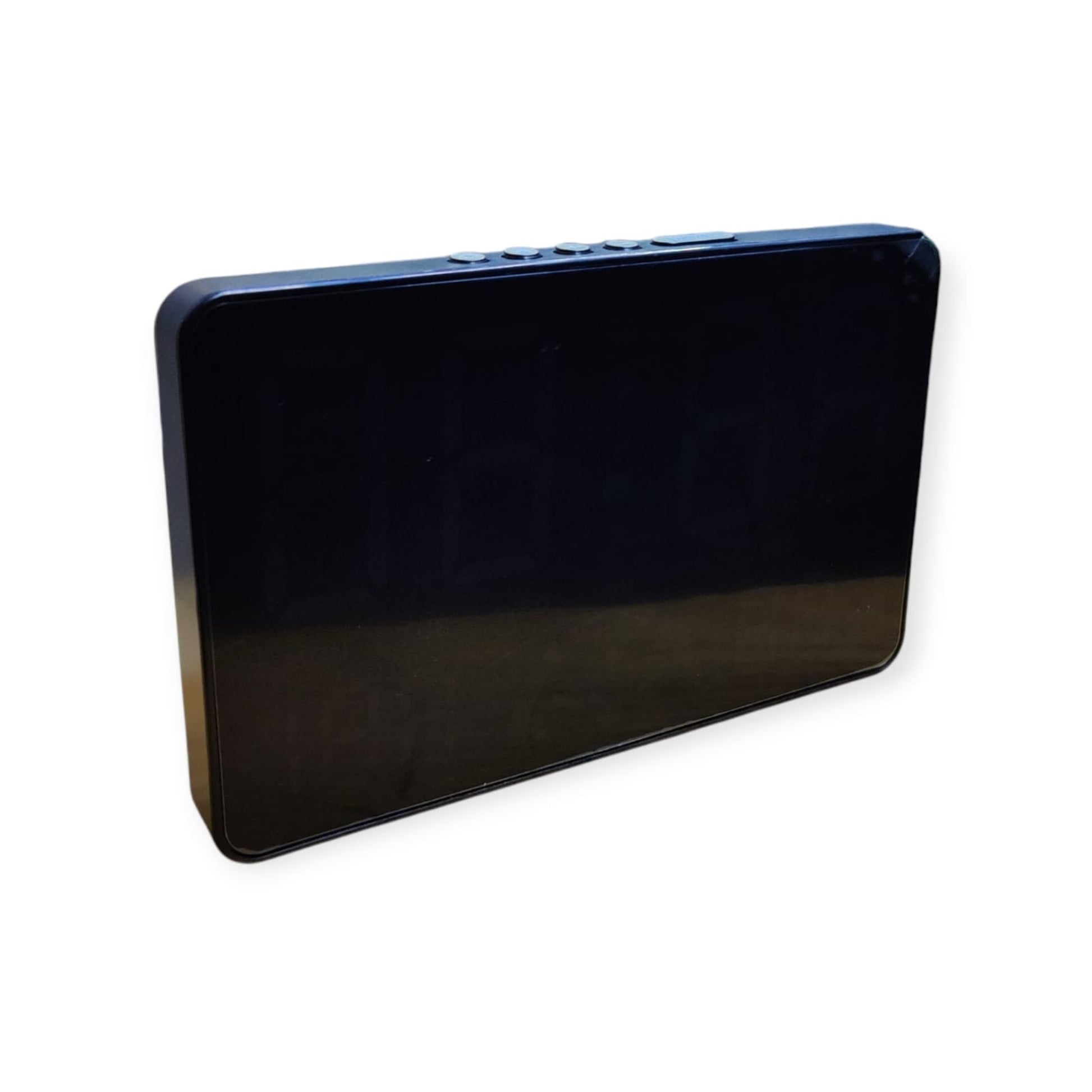 Side and top-angle view of the sleek black digital clock, highlighting the row of control buttons along the top edge.