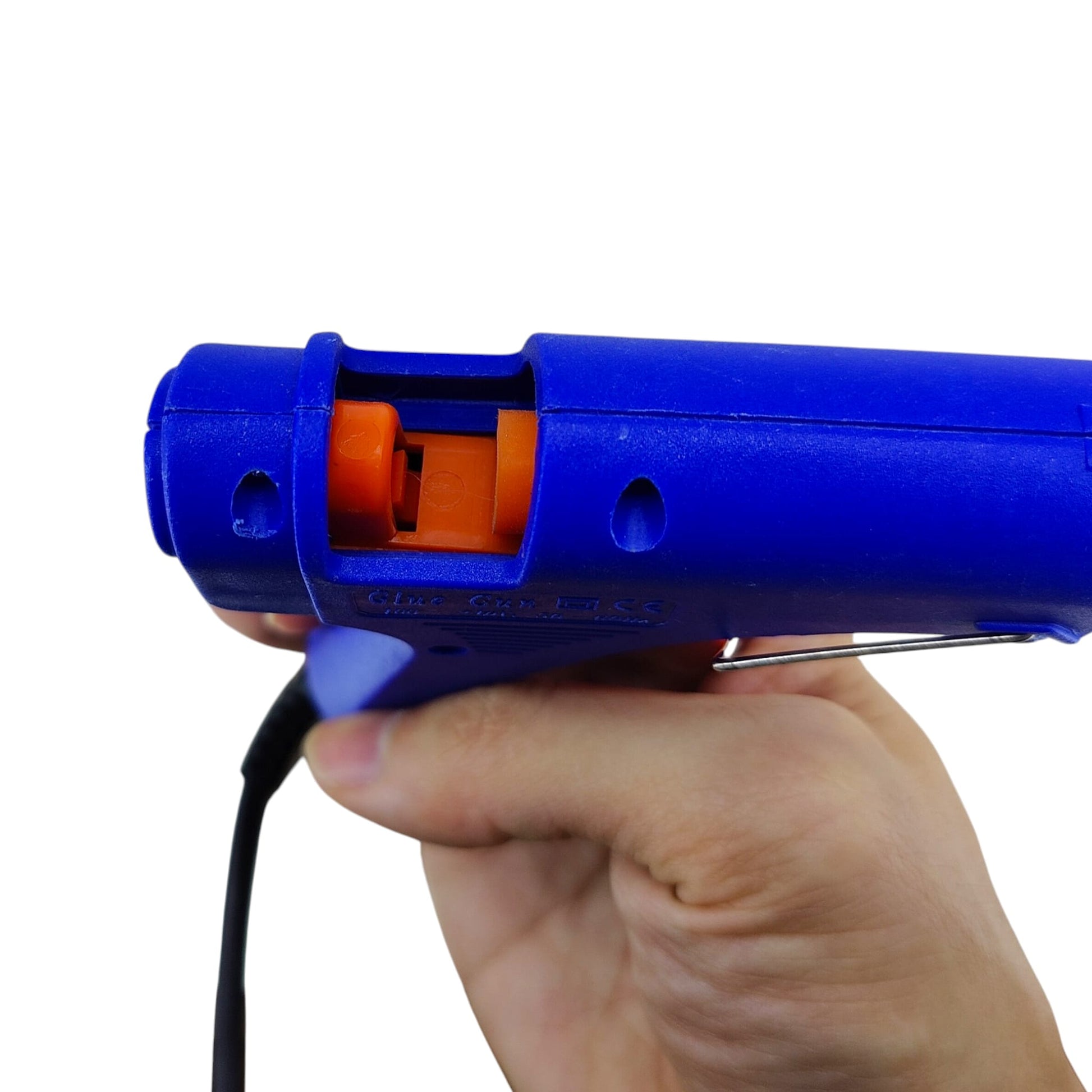 Close-up of the rear loading chamber on the mini hot glue gun where glue sticks are inserted.